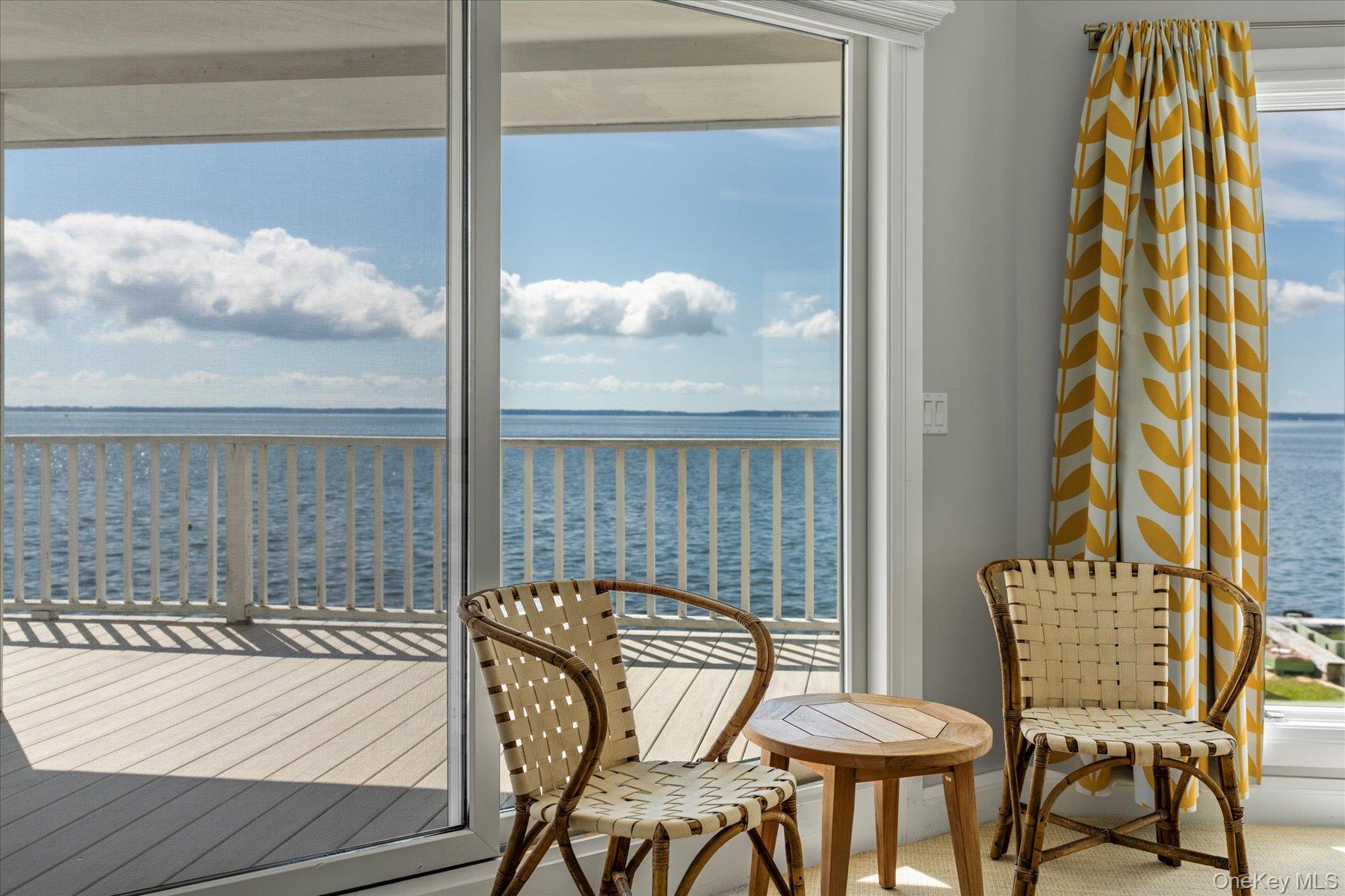 4415 Camp Mineola Road Mattituck, NY 11952 - Photo 22 of 44 Primary balcony perfect for morning coffee or evening cocktails by the water.