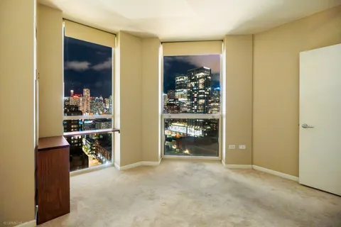 a view of a room with white walls and entryway