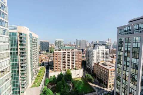 a view of parking garage with cars parked