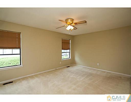 302 Timber Oaks Road Edison, NJ 08820 - Photo 11 of 16 a view of an empty room with a window