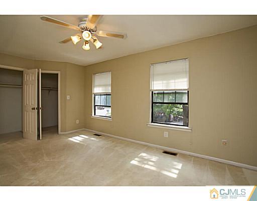 302 Timber Oaks Road Edison, NJ 08820 - Photo 14 of 16 a view of an empty room with a window