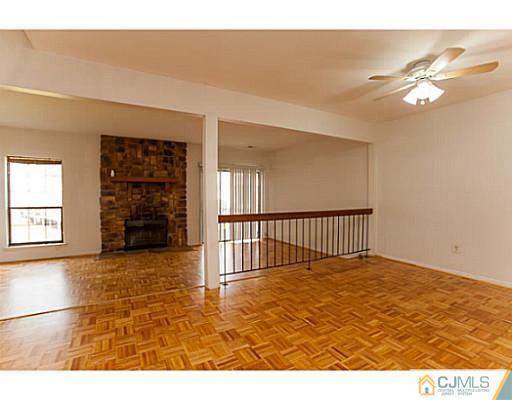 302 Timber Oaks Road Edison, NJ 08820 - Photo 8 of 16 a view of a livingroom with a staircase