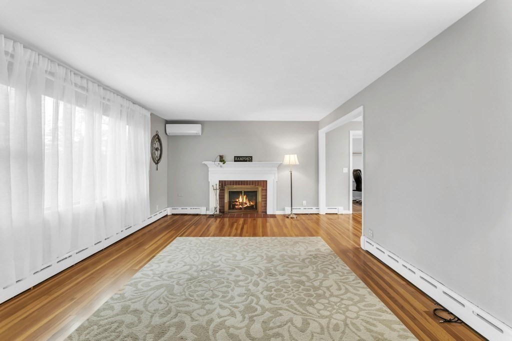 434 Chapin Road Hampden, MA 01036 - Photo 11 of 42 a view of empty room with floor to ceiling window and fireplace