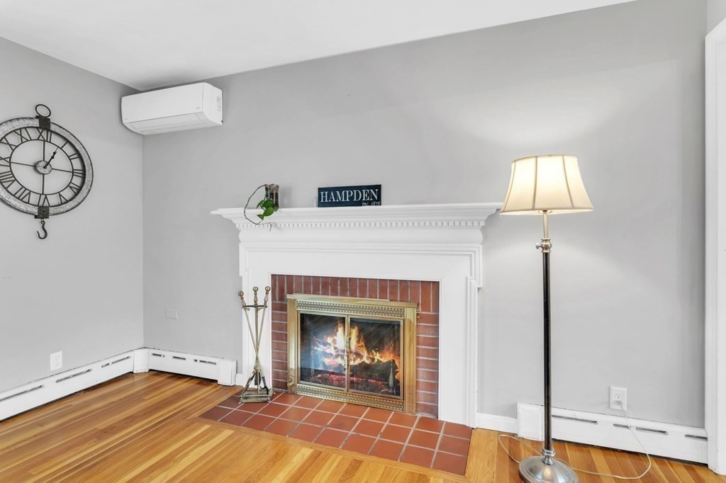 434 Chapin Road Hampden, MA 01036 - Photo 14 of 42 a living room with furniture and a fireplace