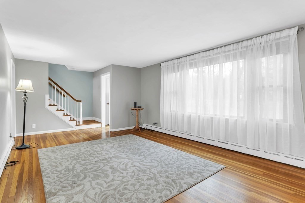 434 Chapin Road Hampden, MA 01036 - Photo 15 of 42 a view of a big room with windows and hardwood floor