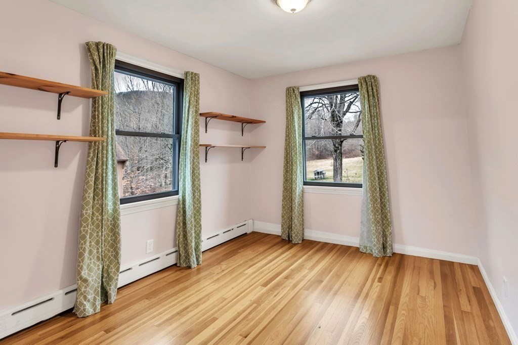 434 Chapin Road Hampden, MA 01036 - Photo 22 of 42 an empty room with wooden floor and windows