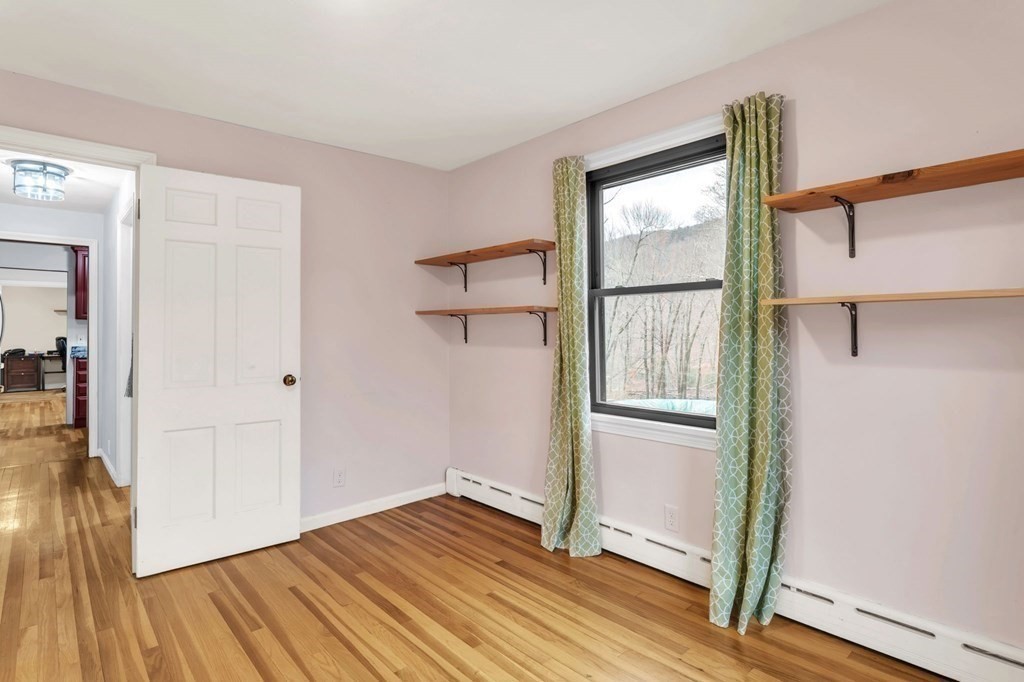 434 Chapin Road Hampden, MA 01036 - Photo 23 of 42 a view of empty room with wooden floor and fan