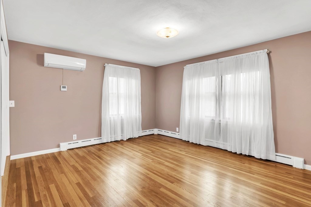 434 Chapin Road Hampden, MA 01036 - Photo 25 of 42 an empty room with wooden floor and windows