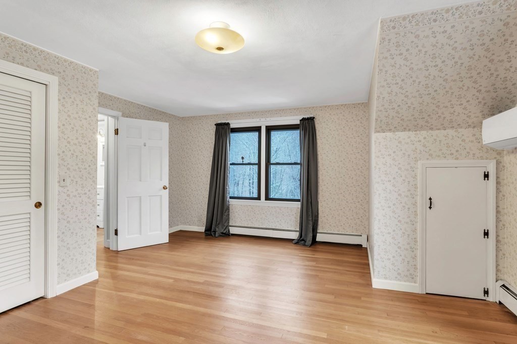 434 Chapin Road Hampden, MA 01036 - Photo 32 of 42 an empty room with wooden floor and windows