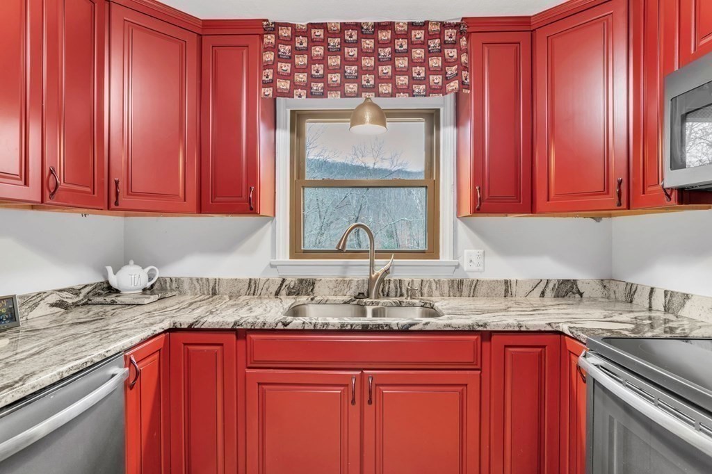 434 Chapin Road Hampden, MA 01036 - Photo 6 of 42 a kitchen with stainless steel appliances granite countertop a sink dishwasher stove and cabinets with wooden floor