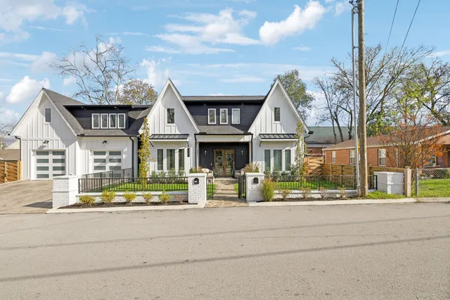 a front view of residential houses with street