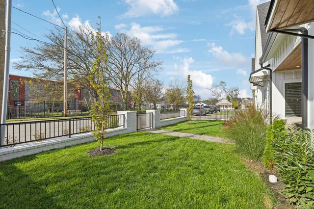a view of a park with large trees