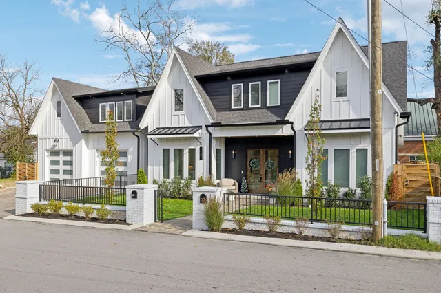 a front view of a house with table and chairs