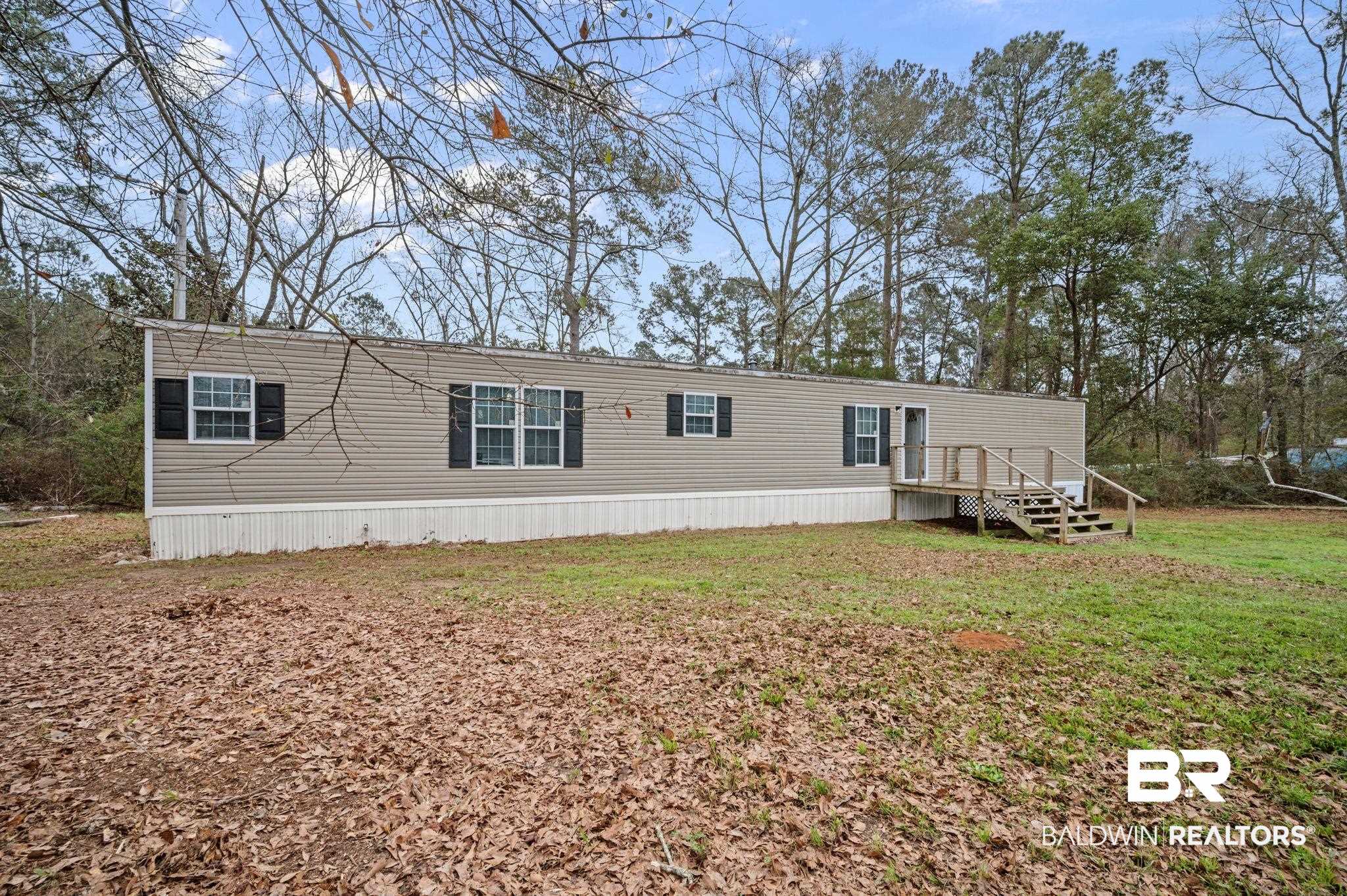 39908 T A Chastang Road Bay Minette, AL 36507 - Photo 1 of 20 View of front of property with a deck and a front lawn