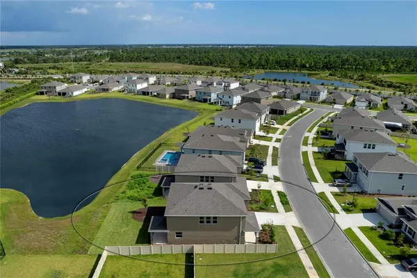 an aerial view of a house with a ocean view
