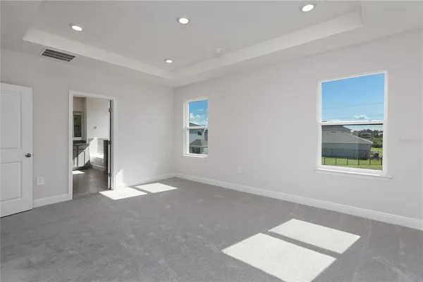 a view of kitchen cabinets and wooden floor