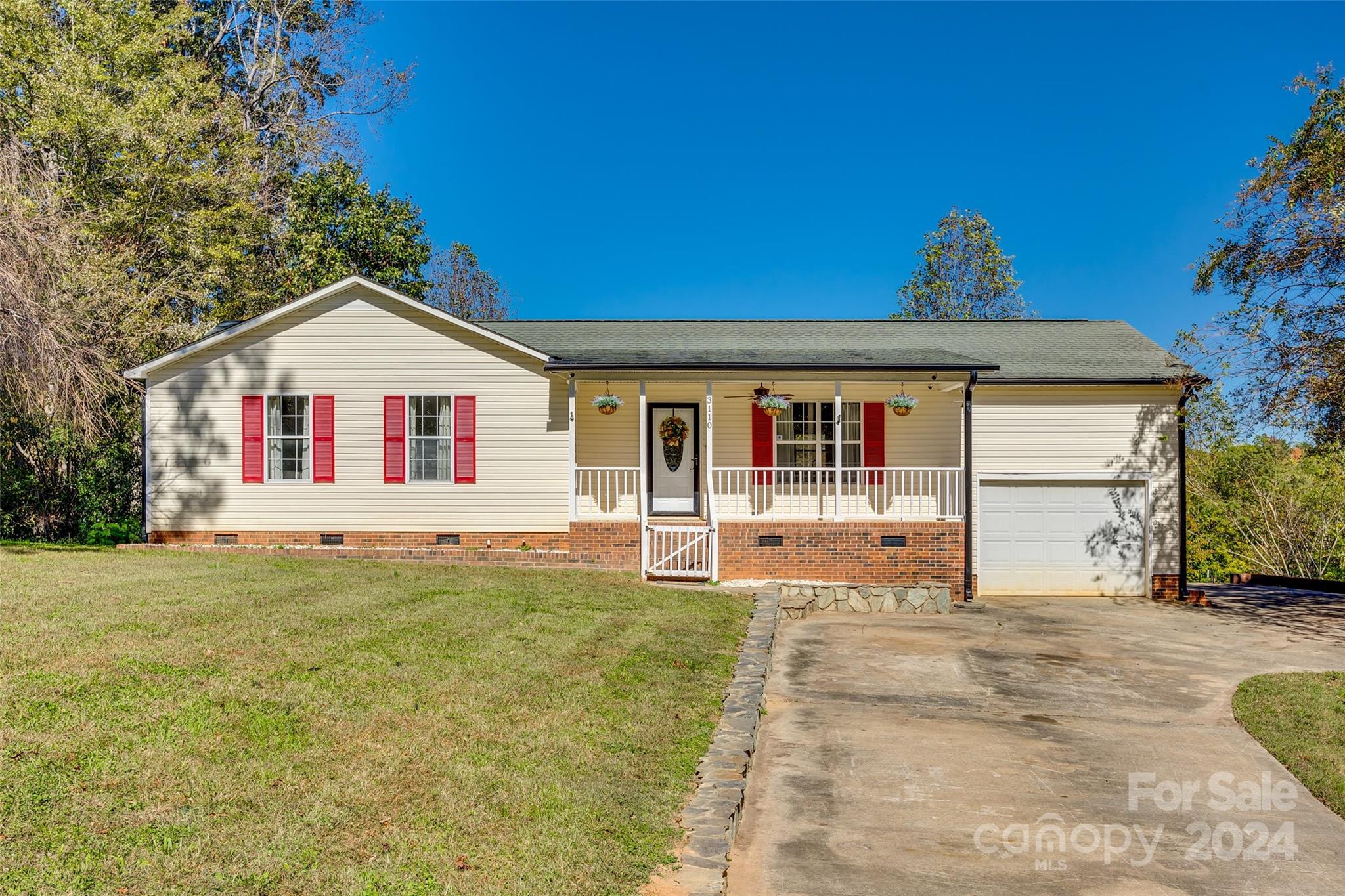 3110 Bush Road Clover, SC 29710 - Photo 1 of 48 a front view of a house with a garden