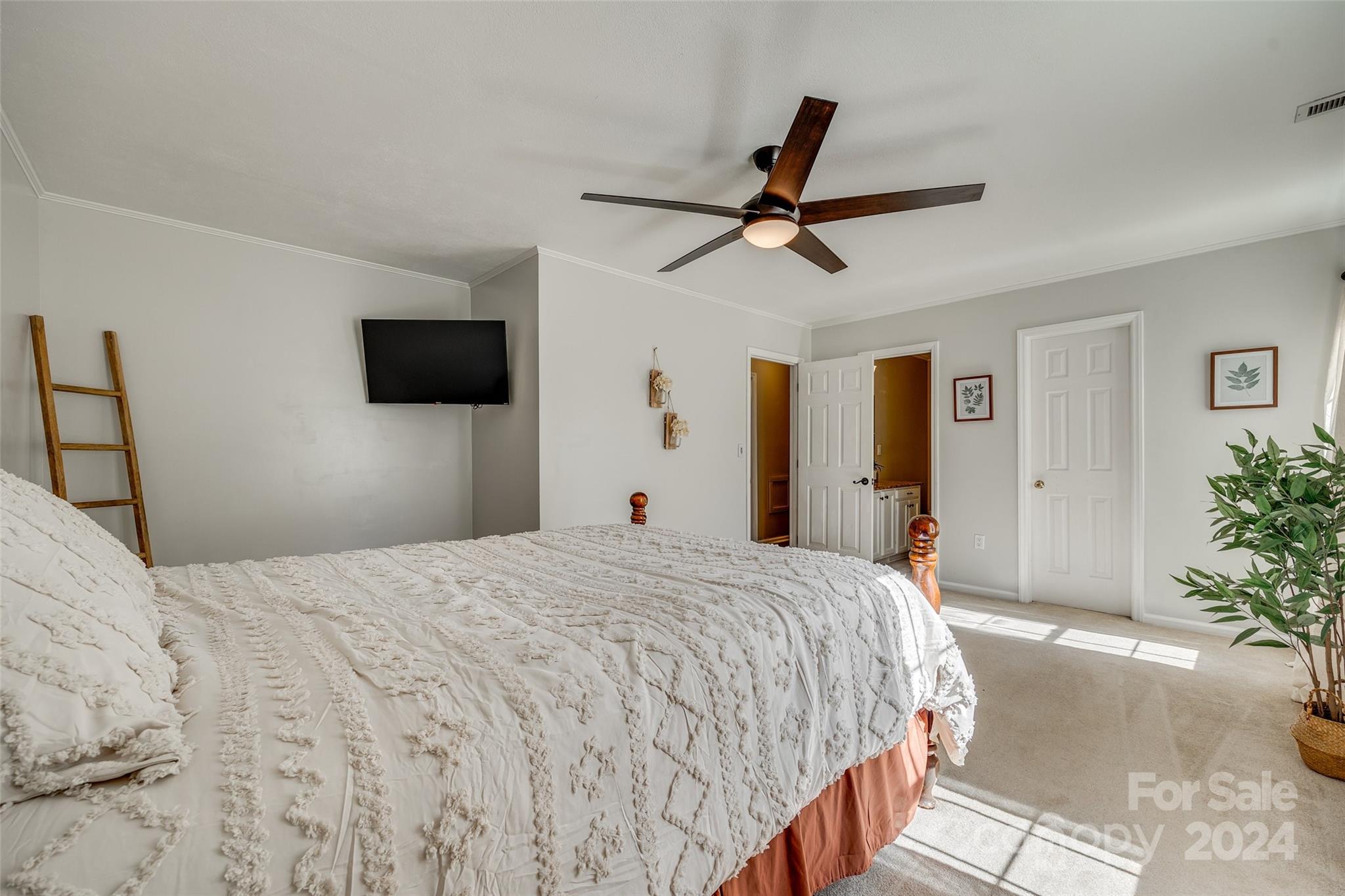 3110 Bush Road Clover, SC 29710 - Photo 18 of 48 a bedroom with a bed and a flat screen tv