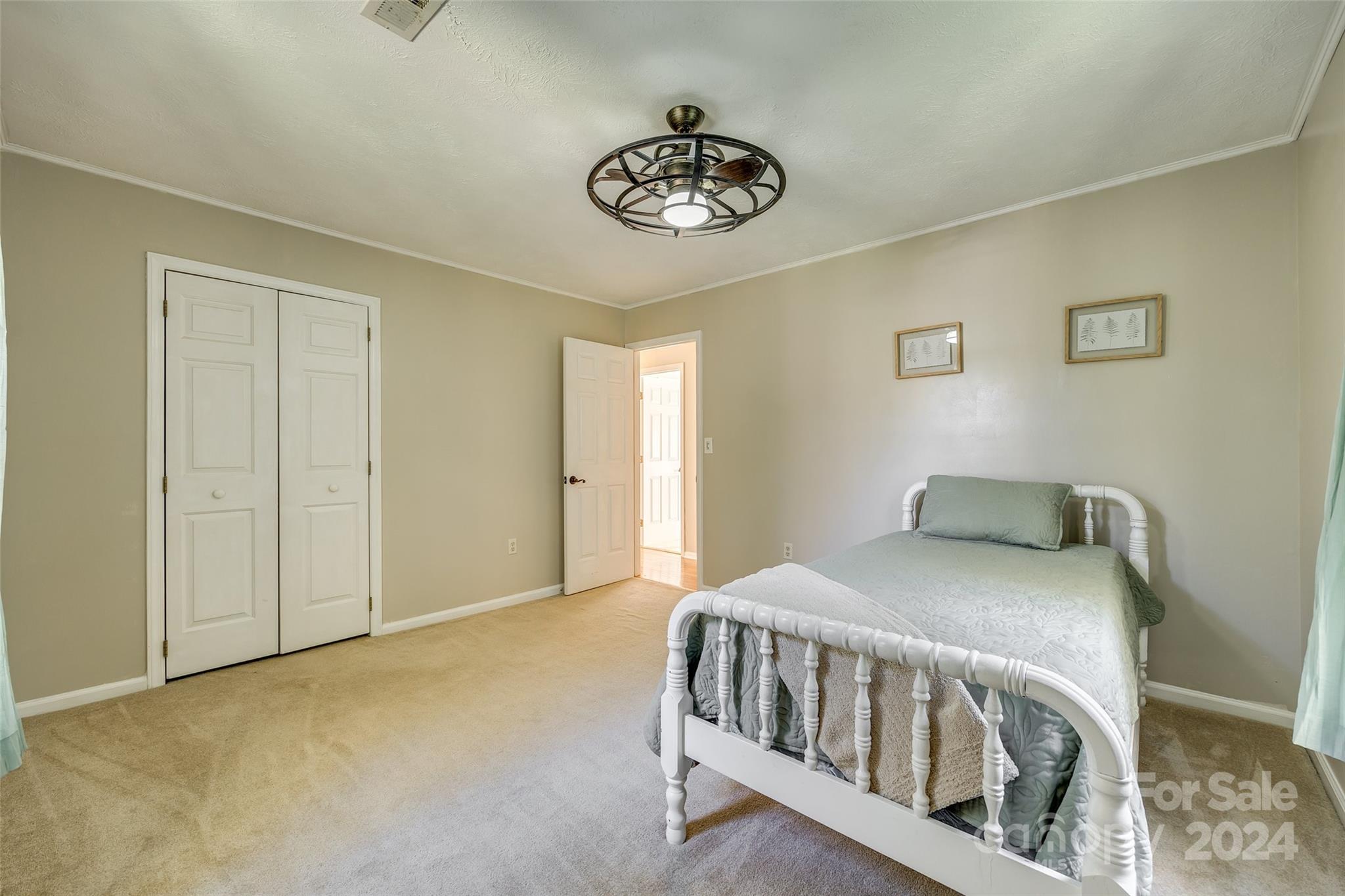 3110 Bush Road Clover, SC 29710 - Photo 22 of 48 a bedroom with a bed and a chandelier