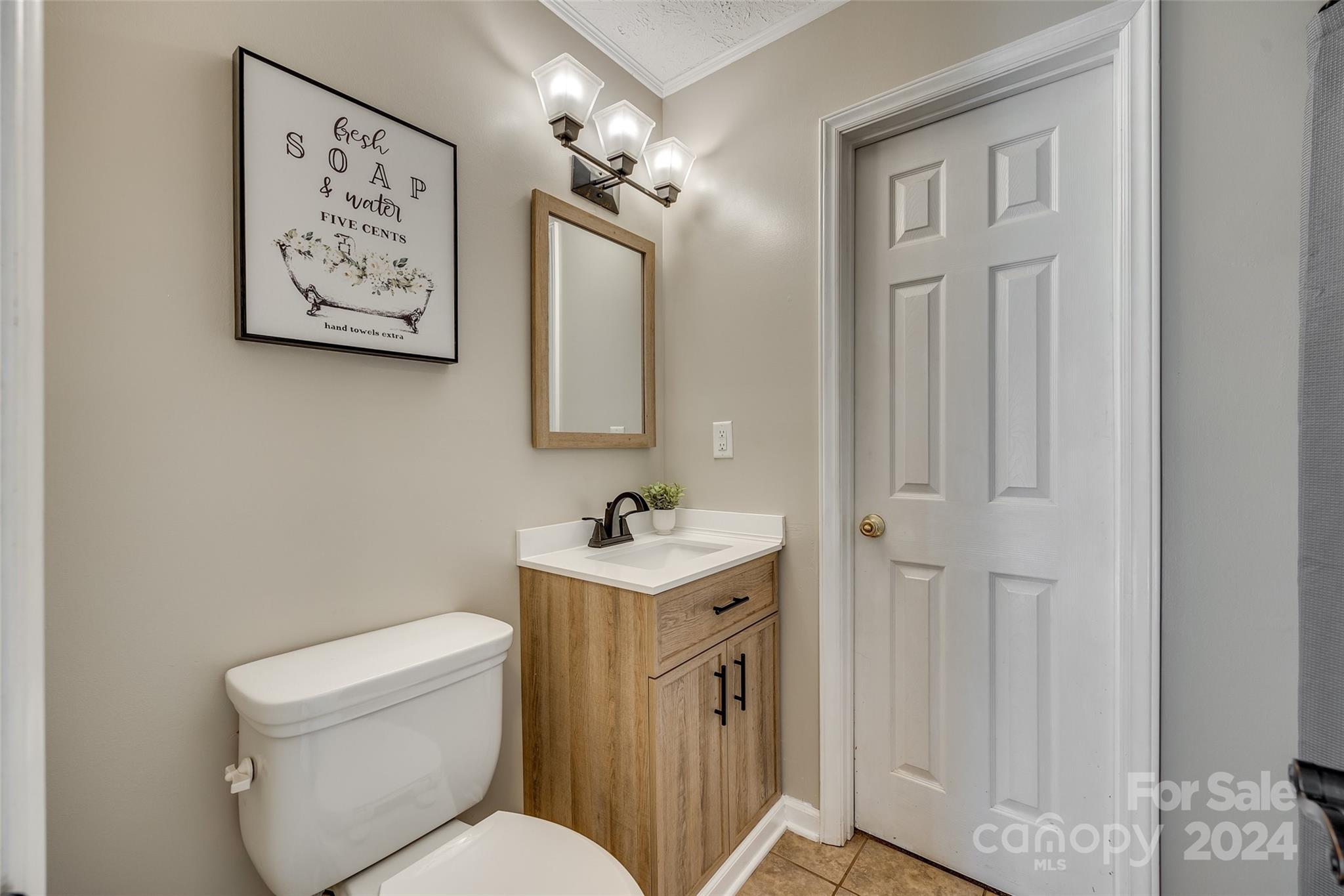 3110 Bush Road Clover, SC 29710 - Photo 24 of 48 a bathroom with a toilet sink and mirror