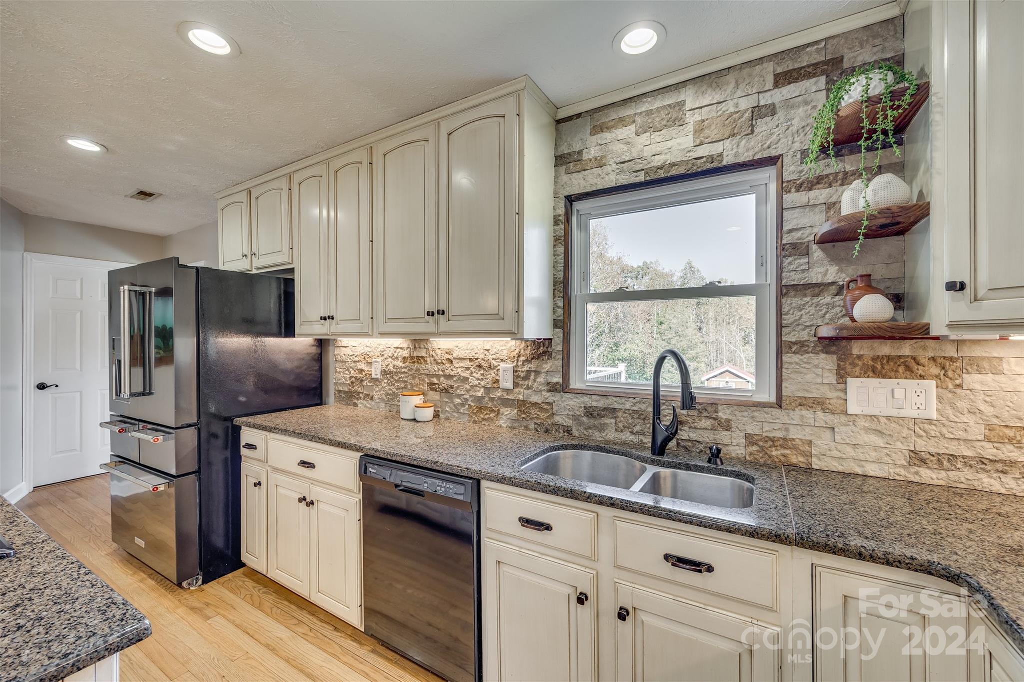 3110 Bush Road Clover, SC 29710 - Photo 8 of 48 a kitchen with stainless steel appliances granite countertop a sink and a refrigerator