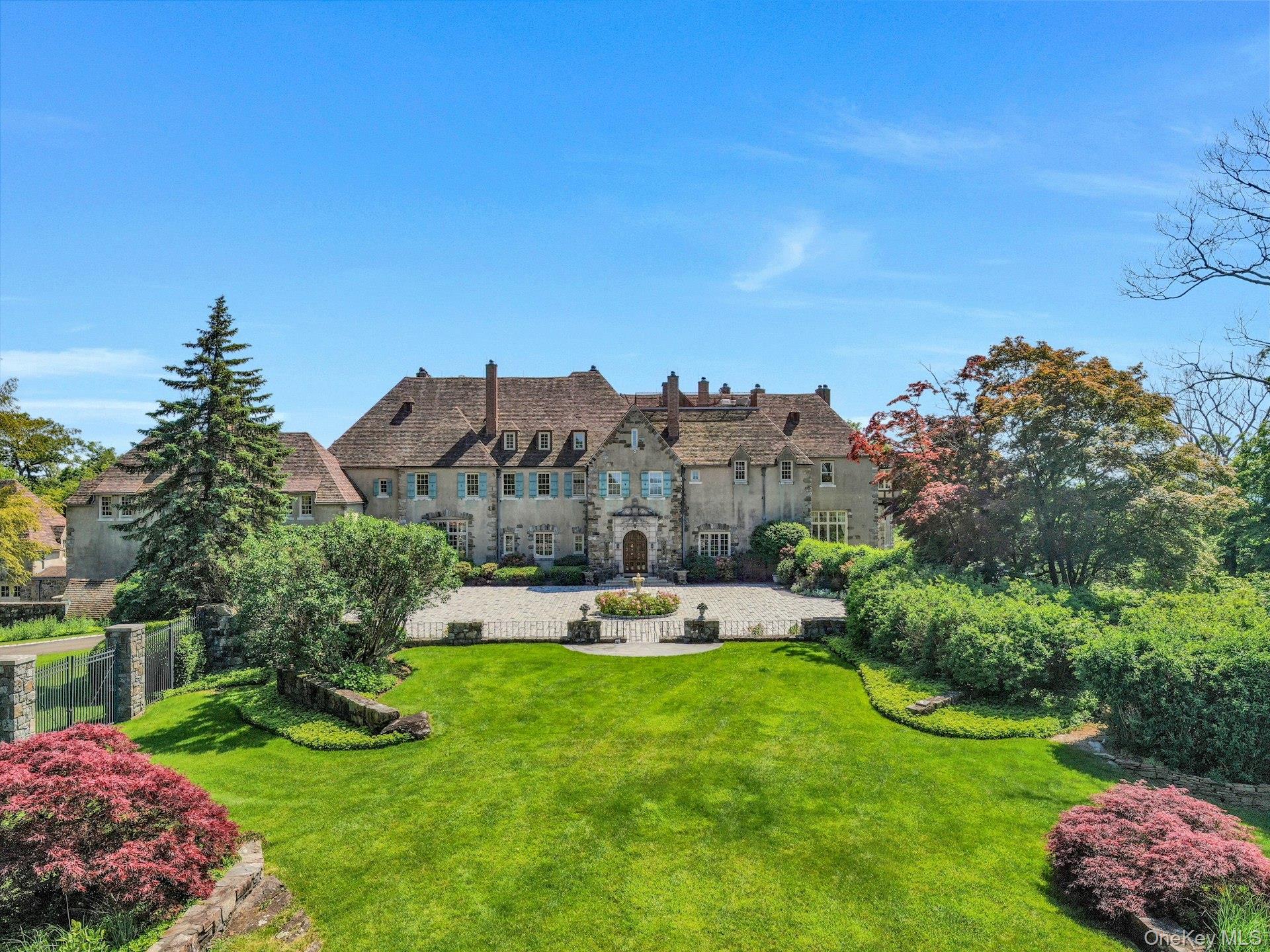 a view of a house with a yard and garden