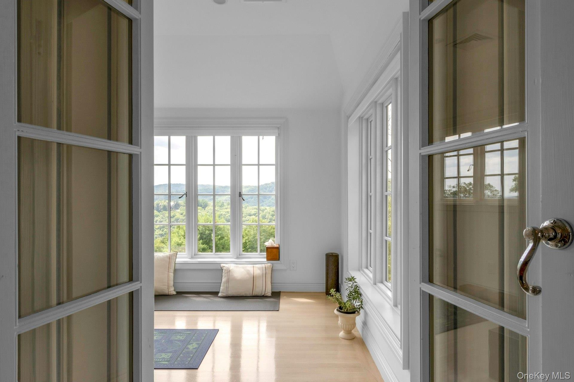 120 Ridge Road Tuxedo Park, NY 10987 - Photo 23 of 50 a view of a bedroom with wooden floor and windows