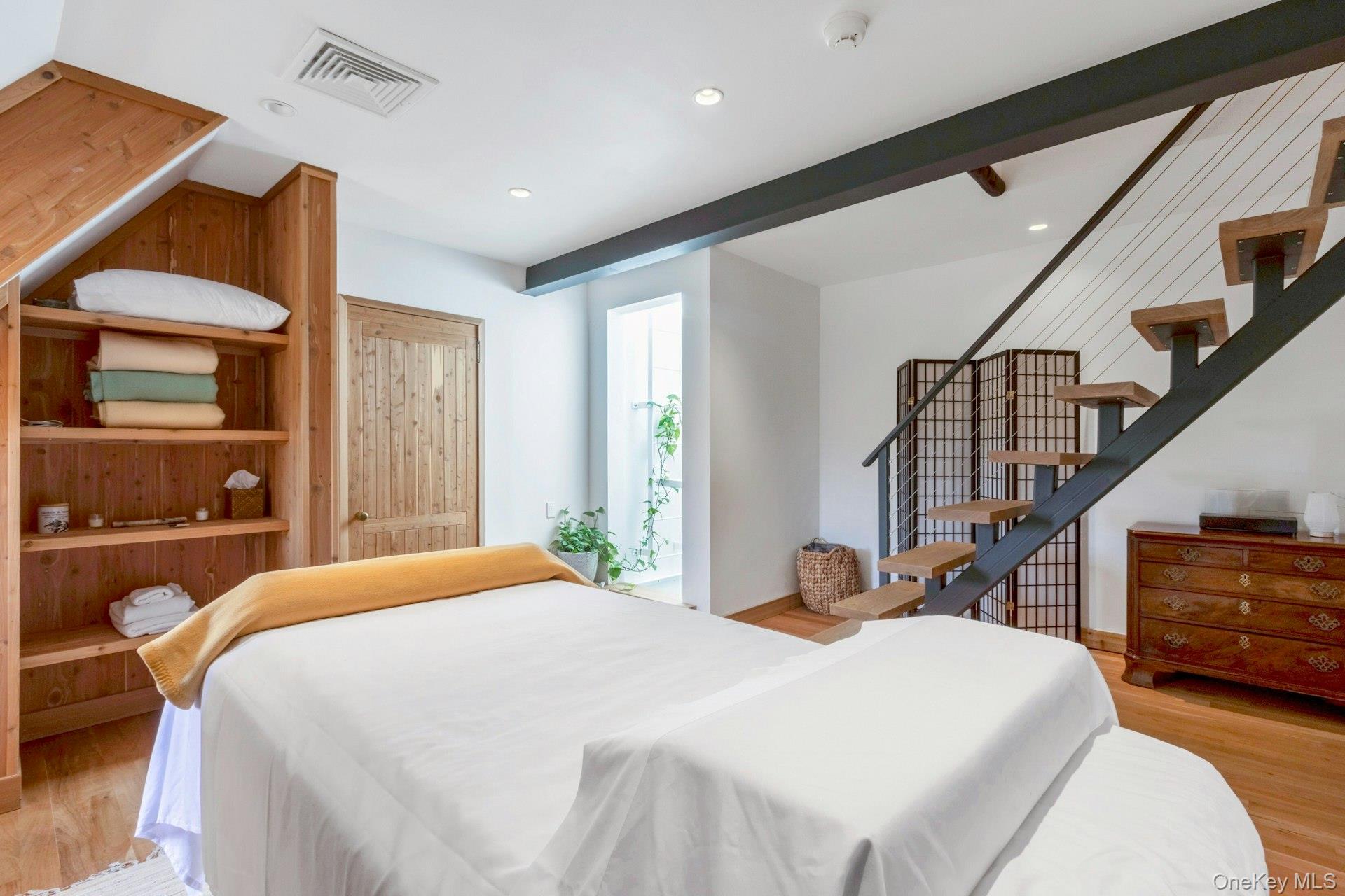 120 Ridge Road Tuxedo Park, NY 10987 - Photo 31 of 50 a bedroom with a bed and wooden floor