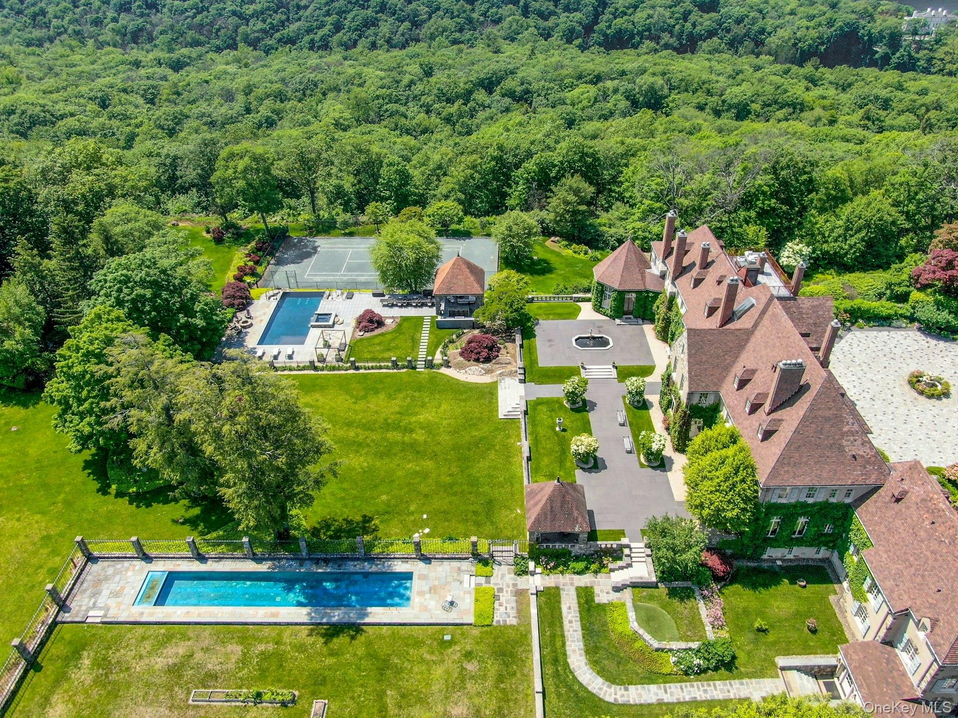 120 Ridge Road Tuxedo Park, NY 10987 - Photo 36 of 50 an aerial view of residential houses with outdoor space and swimming pool