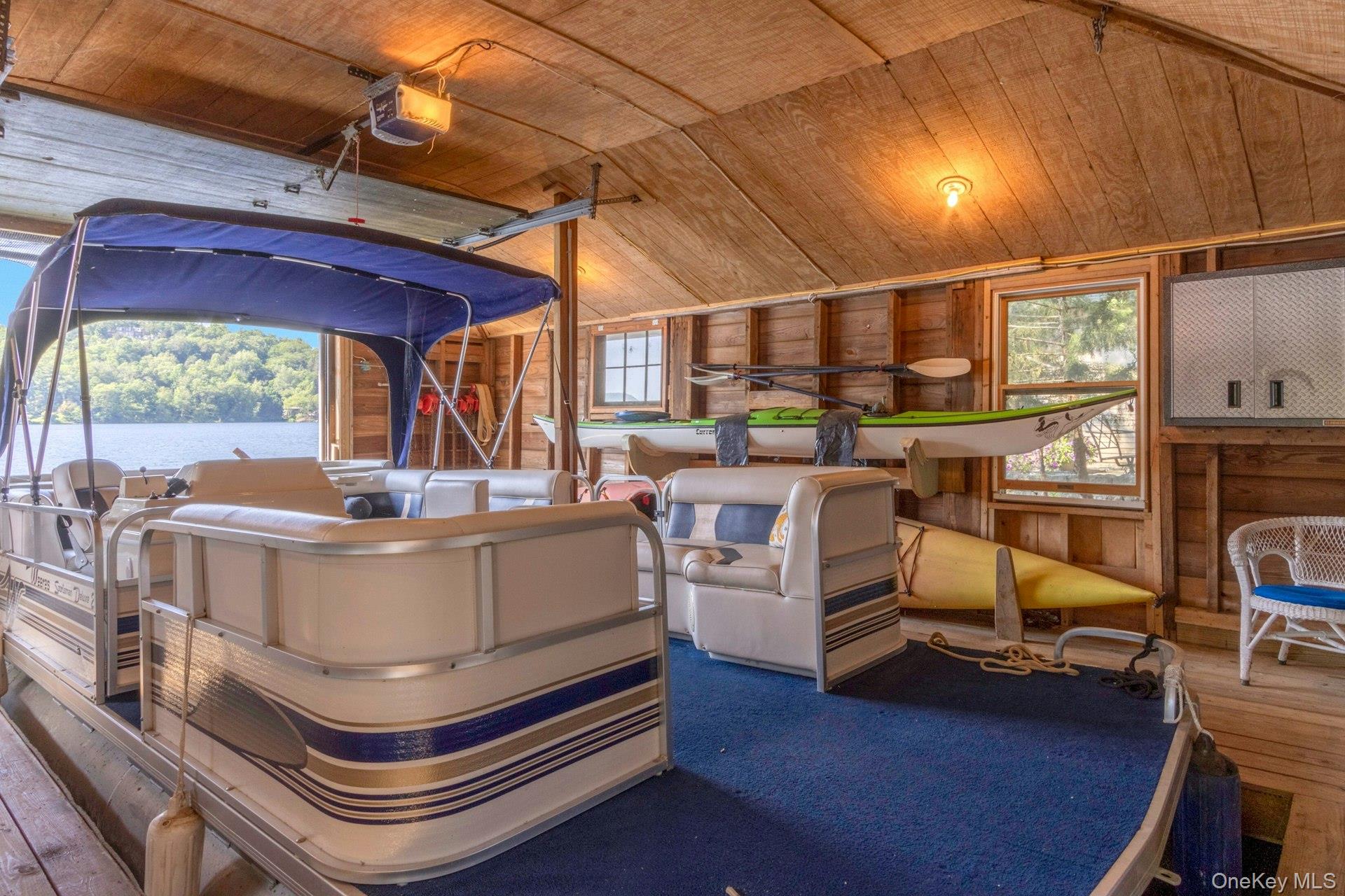 120 Ridge Road Tuxedo Park, NY 10987 - Photo 38 of 50 a room with furniture and a chandelier