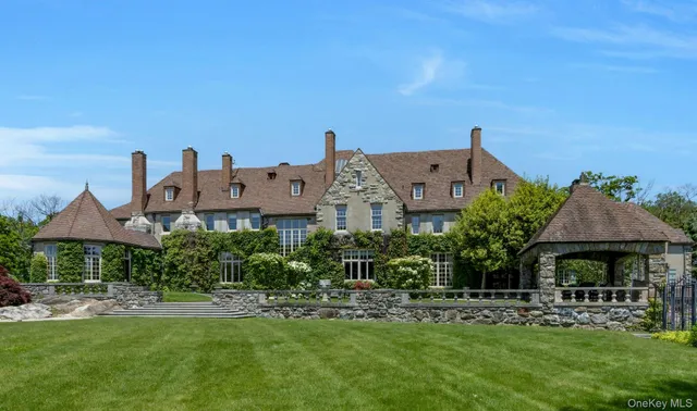 a view of a house with a yard porch and sitting area