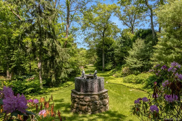 a view of a city with lush green forest