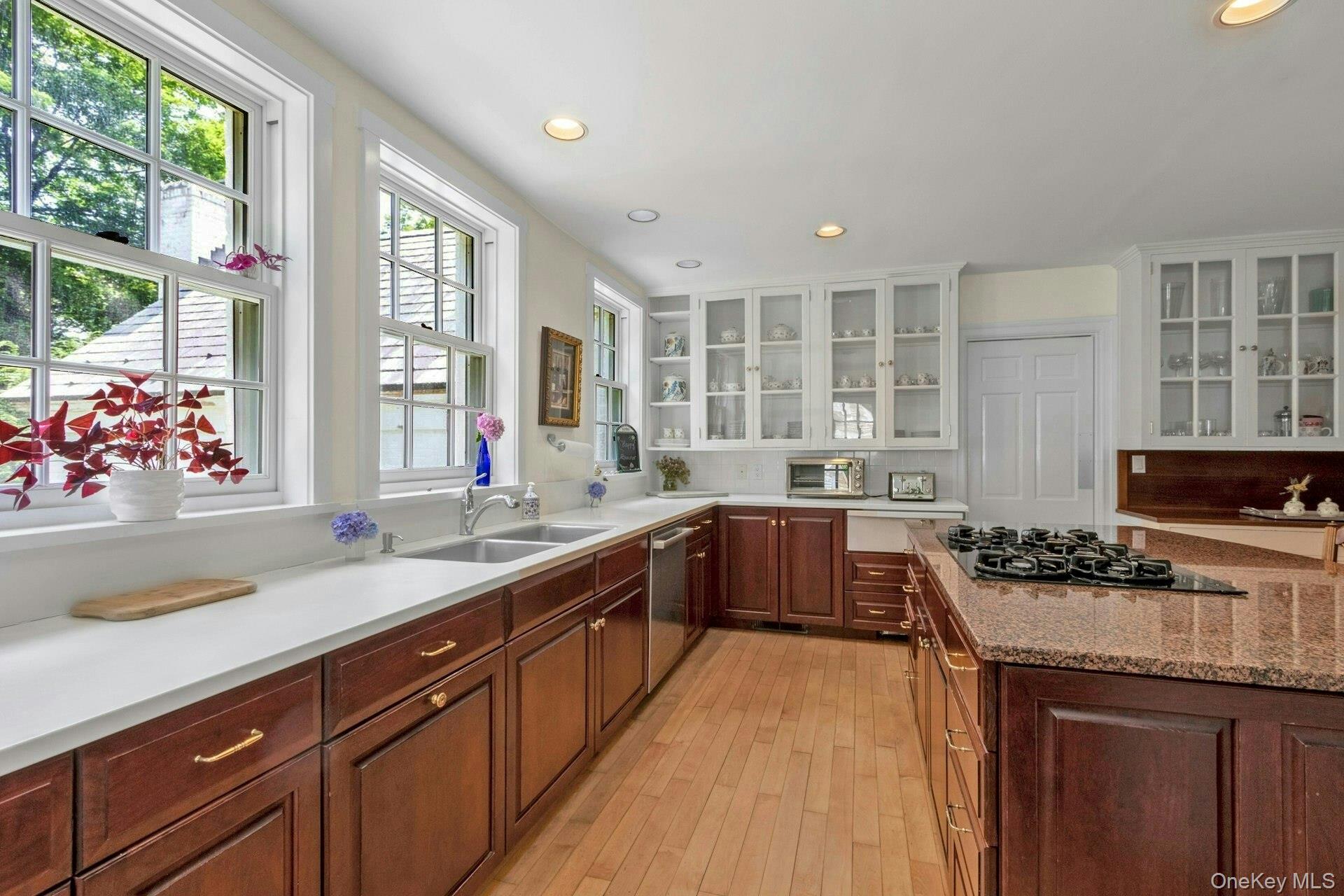 120 Ridge Road Tuxedo Park, NY 10987 - Photo 46 of 50 a kitchen with stainless steel appliances granite countertop a sink stove and cabinets