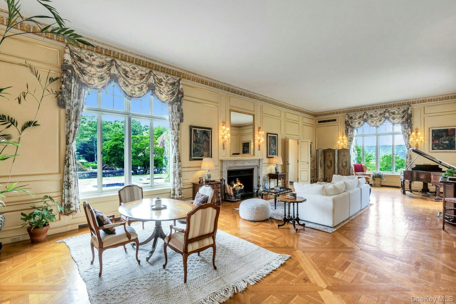 120 Ridge Road Tuxedo Park, NY 10987 - Photo 9 of 50 a living room with fireplace furniture and a large window