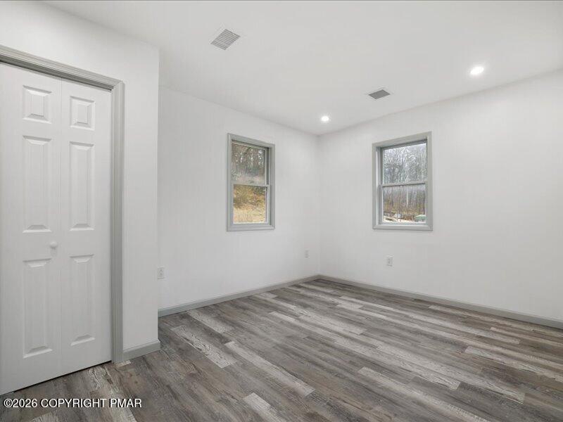 689 Main Road Hunlock Creek, PA 18621 - Photo 16 of 38 a view of room with window and hardwood floor