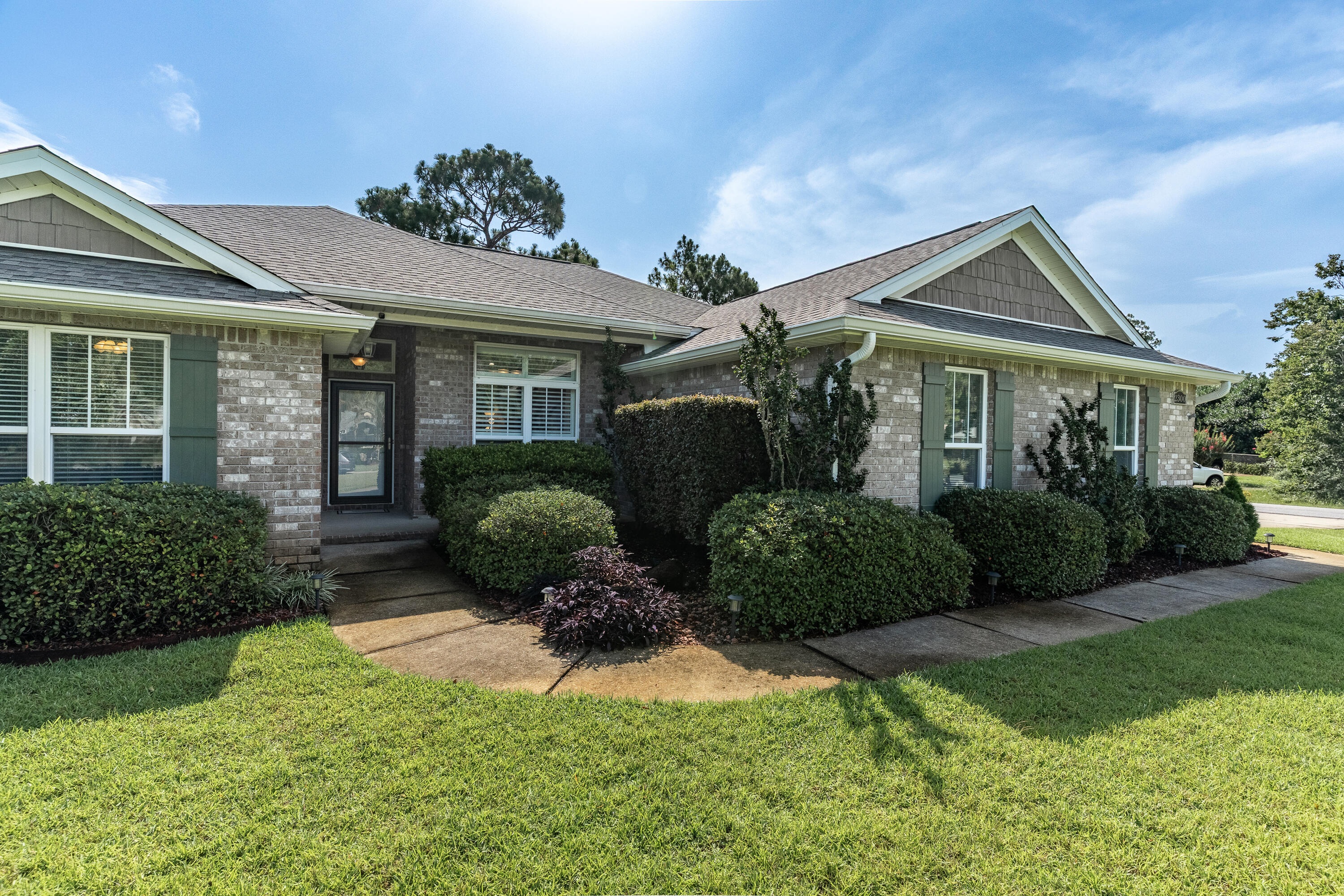 2300 Valley Place Navarre, FL 32566 - Photo 2 of 81 a front view of a house with garden