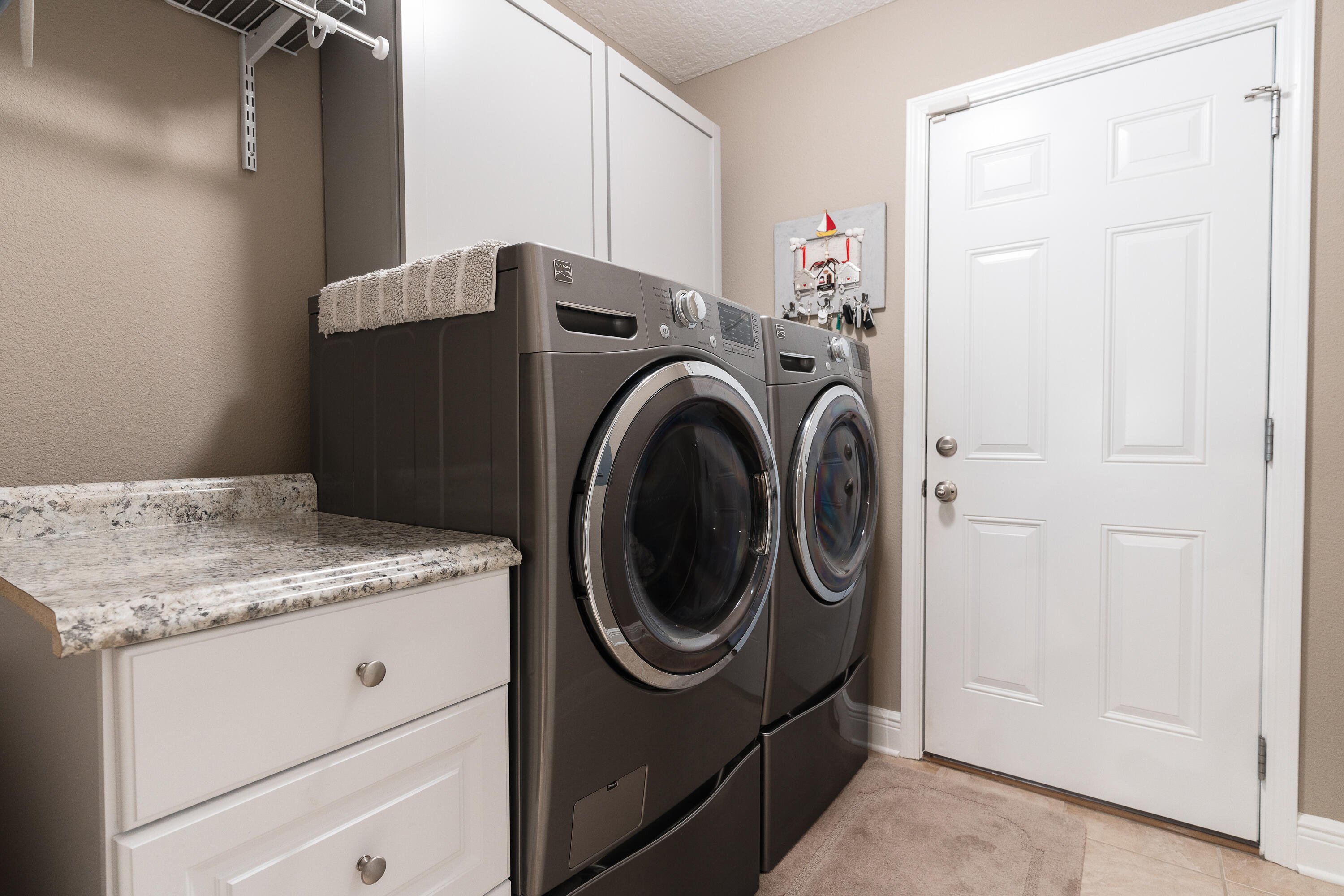 2300 Valley Place Navarre, FL 32566 - Photo 25 of 81 a utility room with dryer and washer