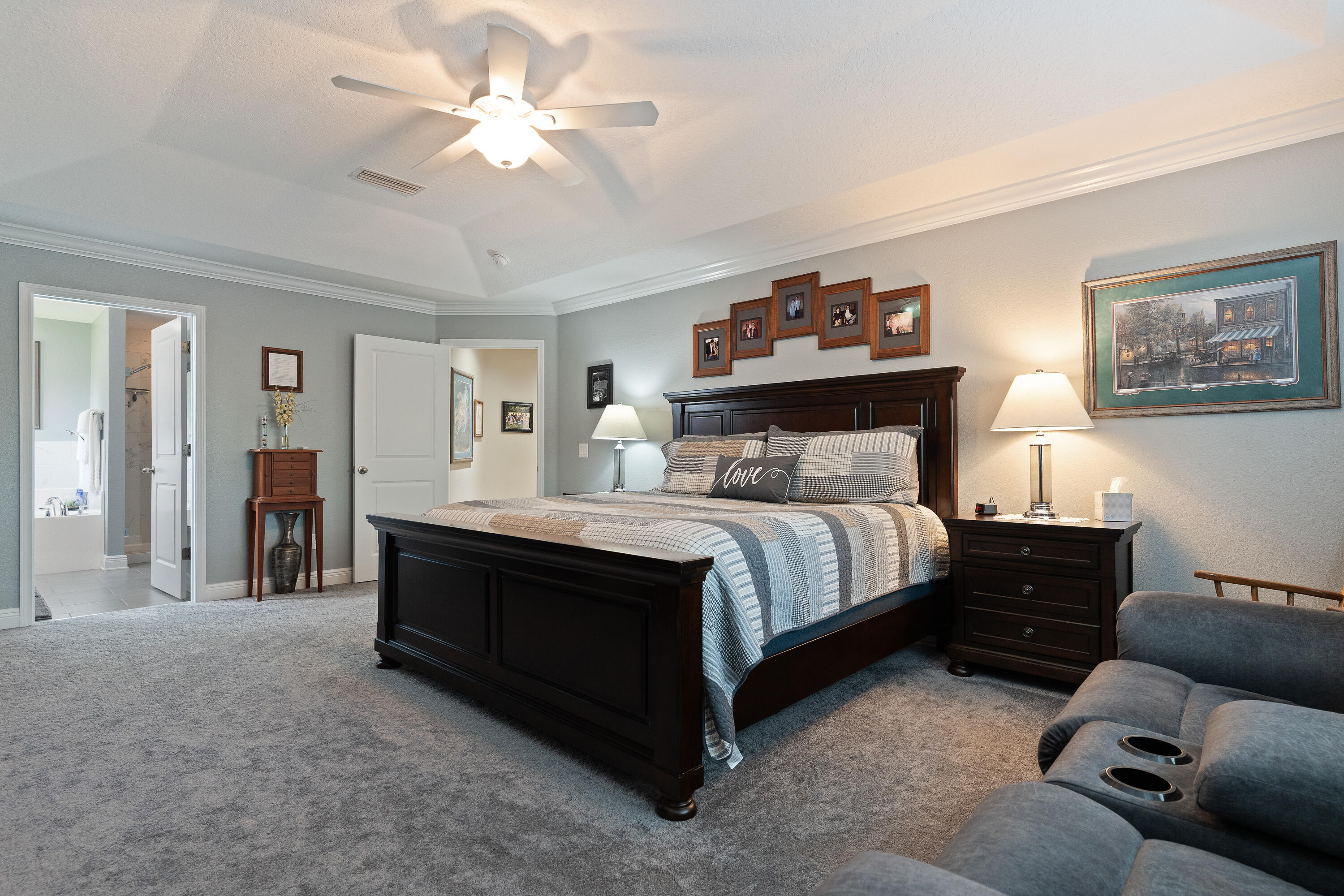 2300 Valley Place Navarre, FL 32566 - Photo 30 of 81 a bed room with a bed and a chandelier
