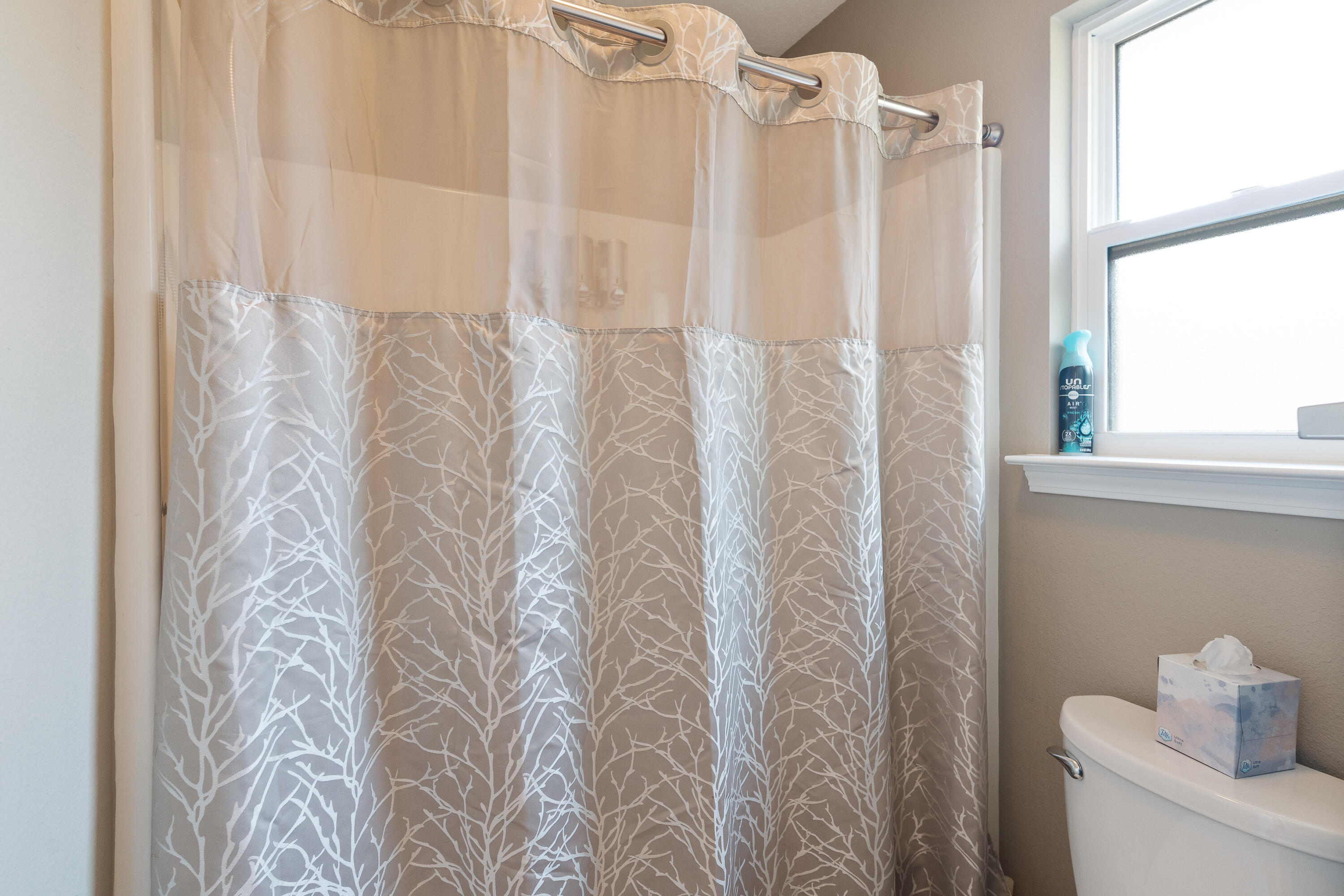 2300 Valley Place Navarre, FL 32566 - Photo 43 of 81 a bathroom with a shower curtain and a toilet