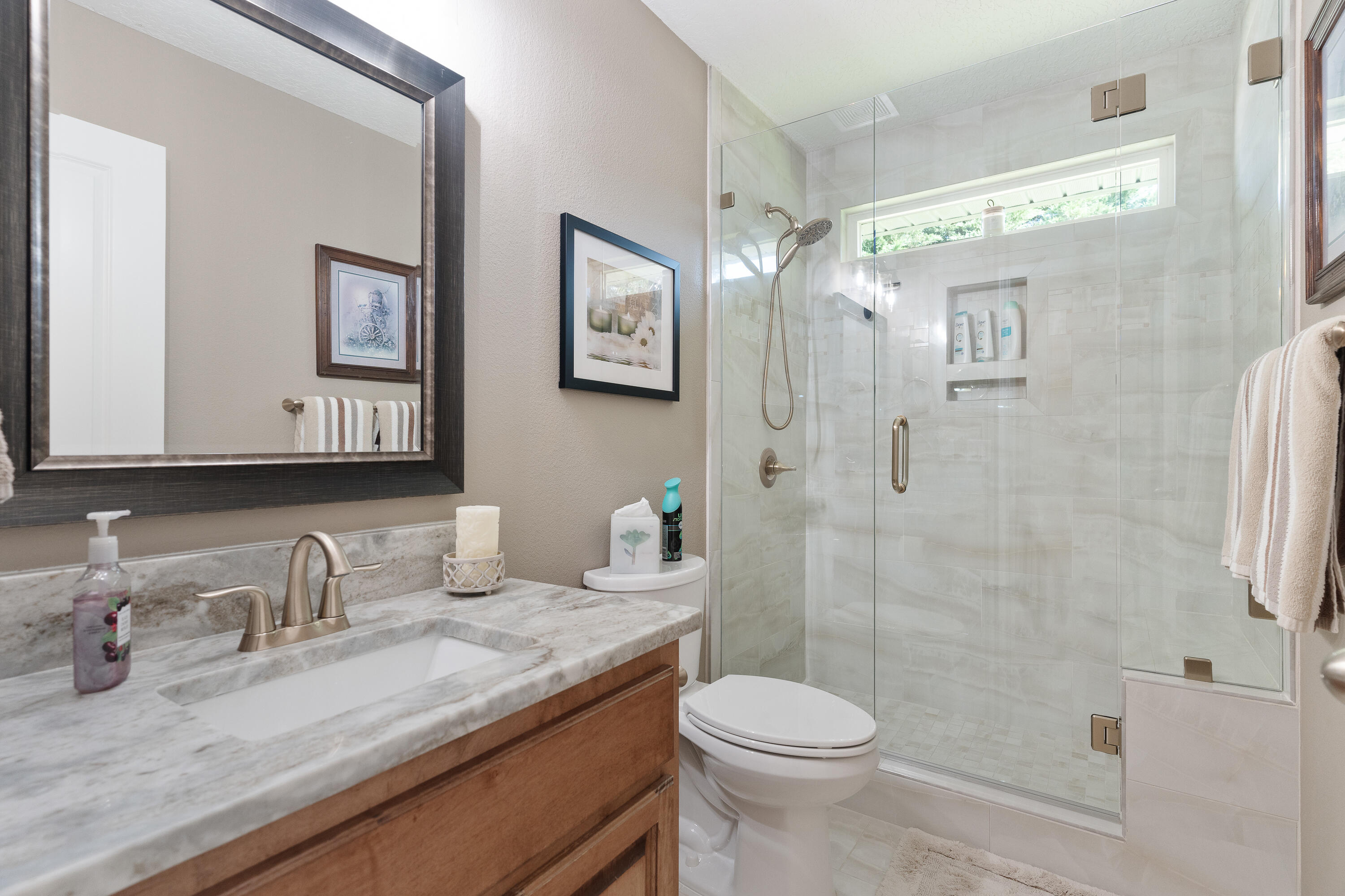 2300 Valley Place Navarre, FL 32566 - Photo 44 of 81 a bathroom with a granite countertop sink toilet and shower