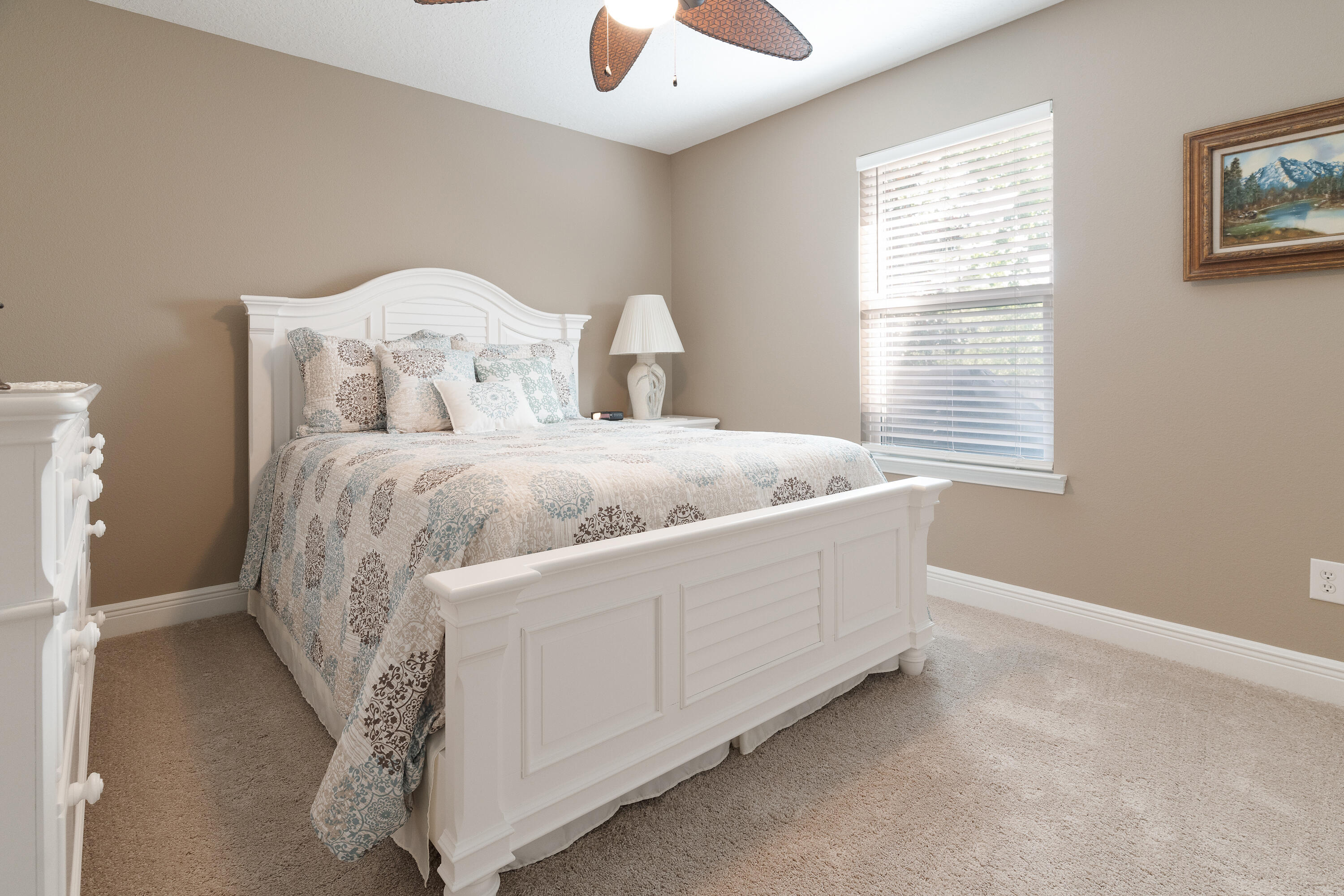 2300 Valley Place Navarre, FL 32566 - Photo 49 of 81 a bed sitting in a bedroom next to a window