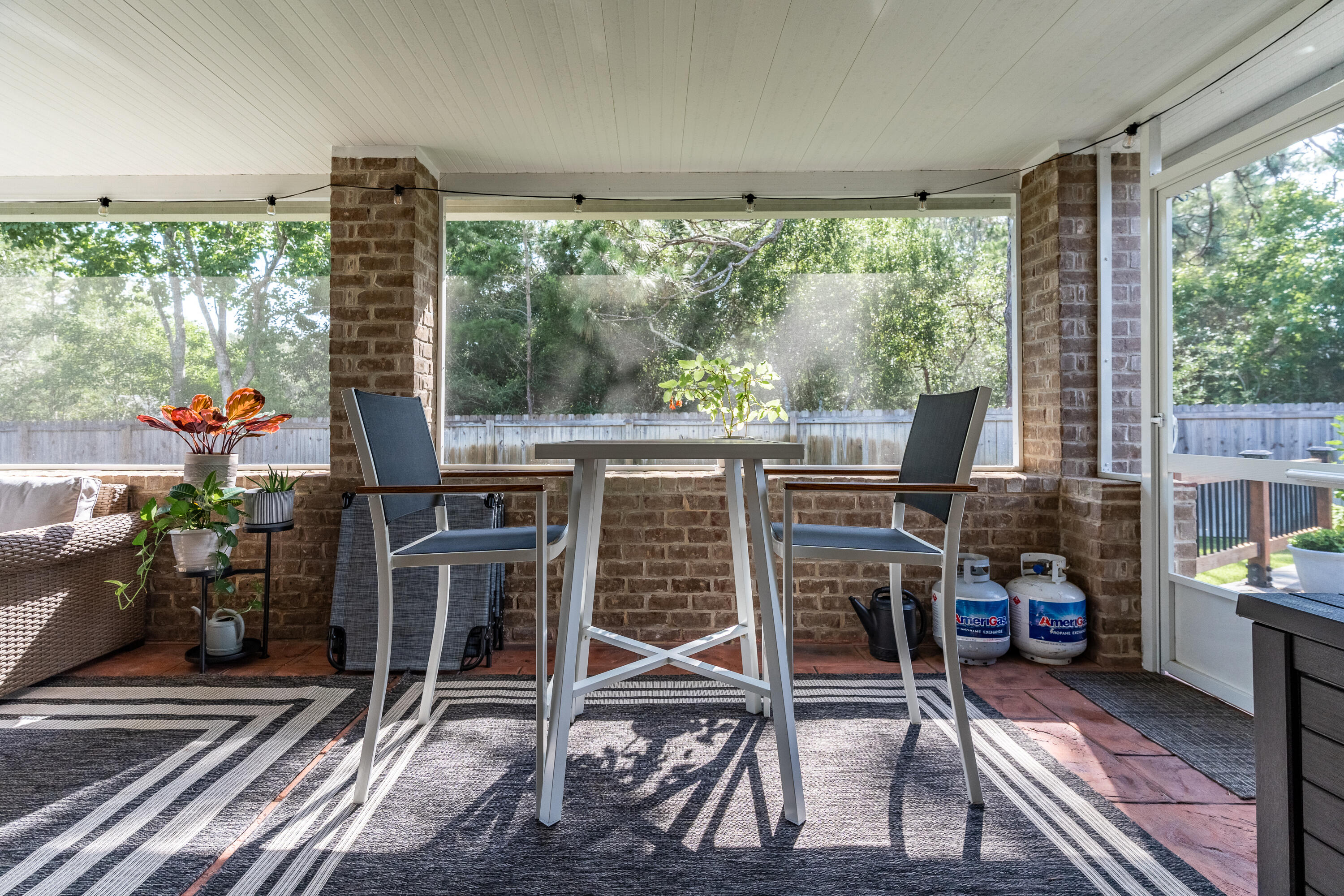 2300 Valley Place Navarre, FL 32566 - Photo 54 of 81 a view of a porch with furniture and garden