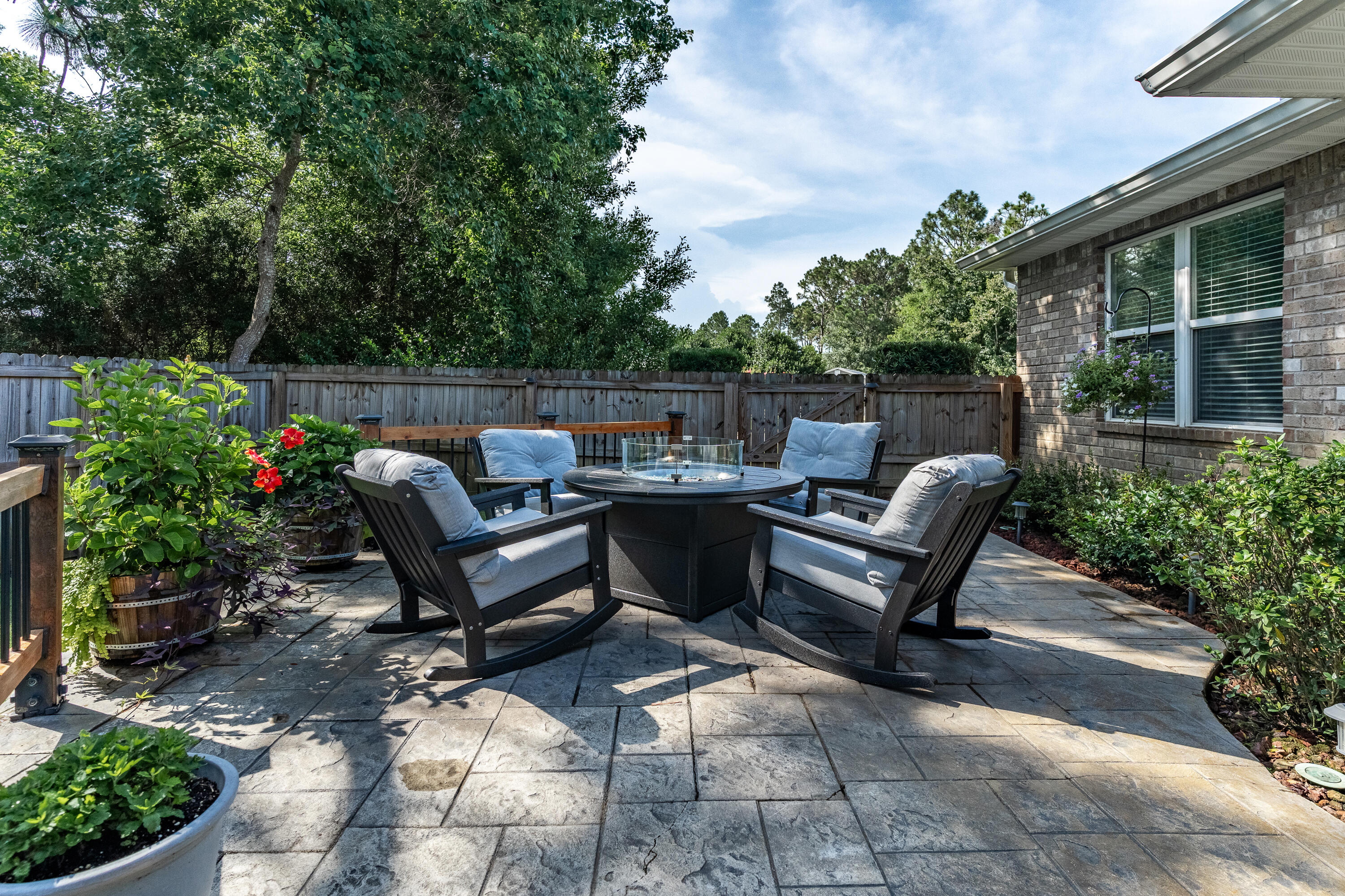 2300 Valley Place Navarre, FL 32566 - Photo 61 of 81 a view of a patio with a chairs and plants