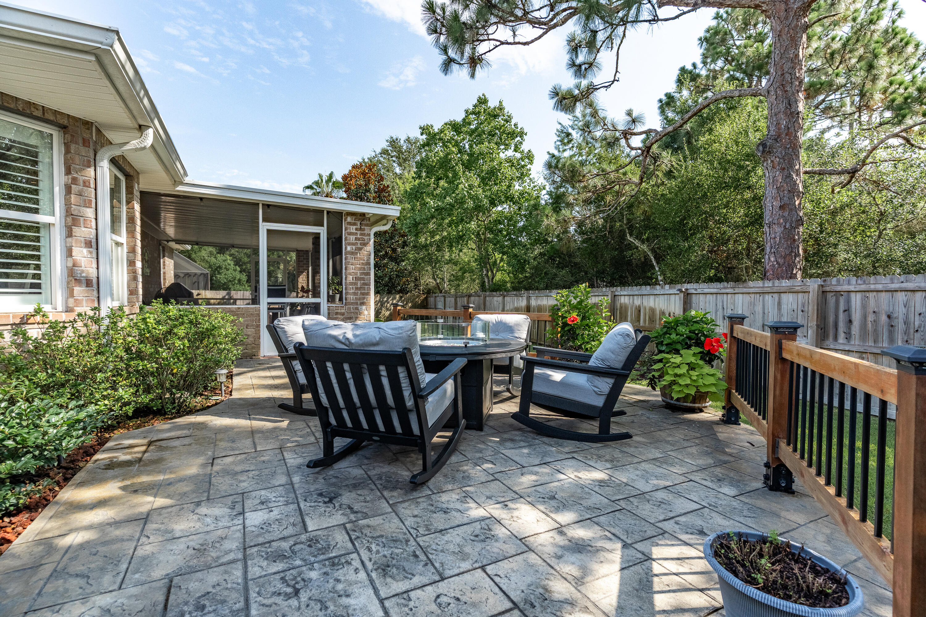 2300 Valley Place Navarre, FL 32566 - Photo 63 of 81 a view of a patio with a table and chairs