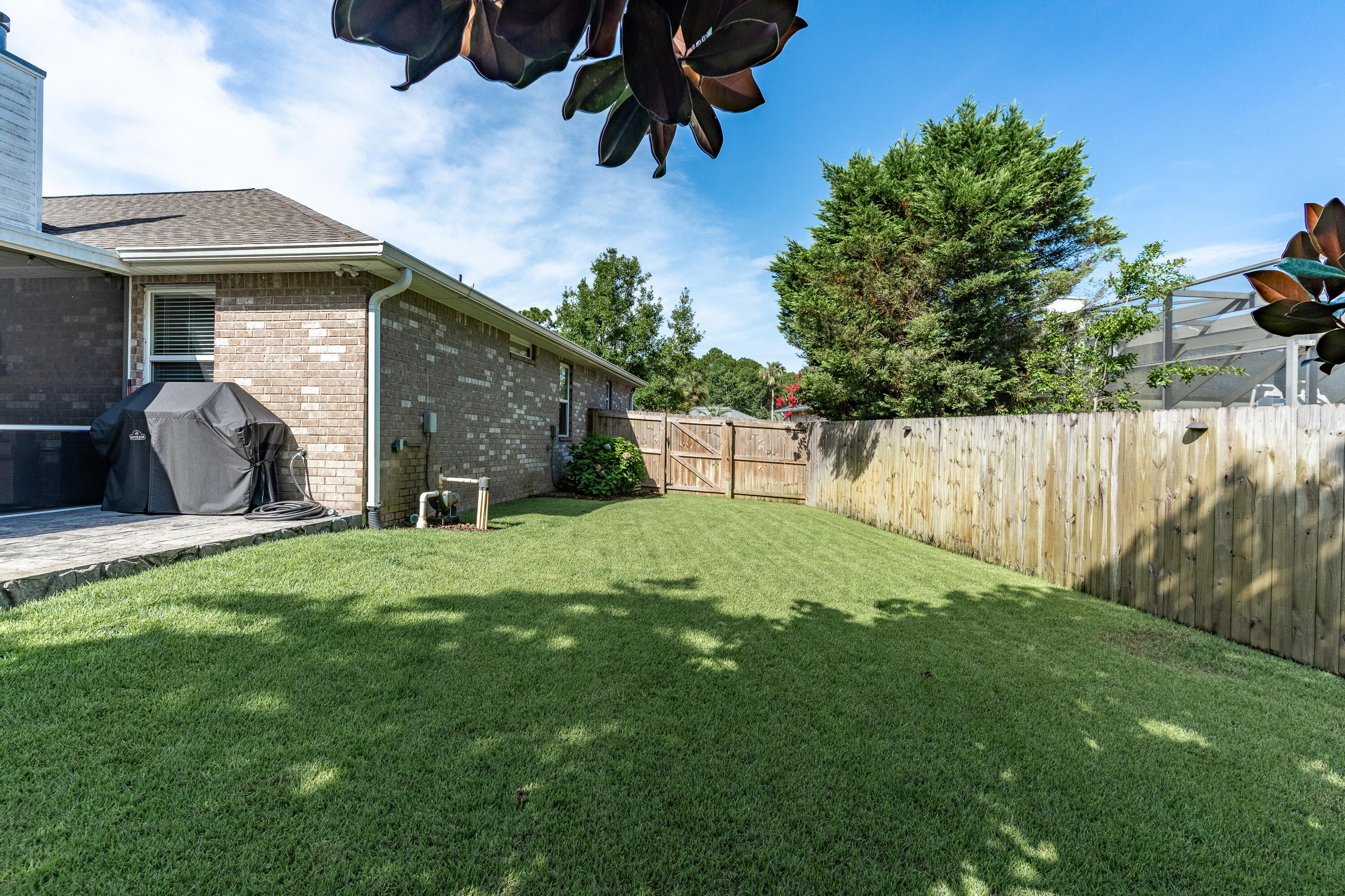 2300 Valley Place Navarre, FL 32566 - Photo 67 of 81 a view of a house with backyard and sitting area