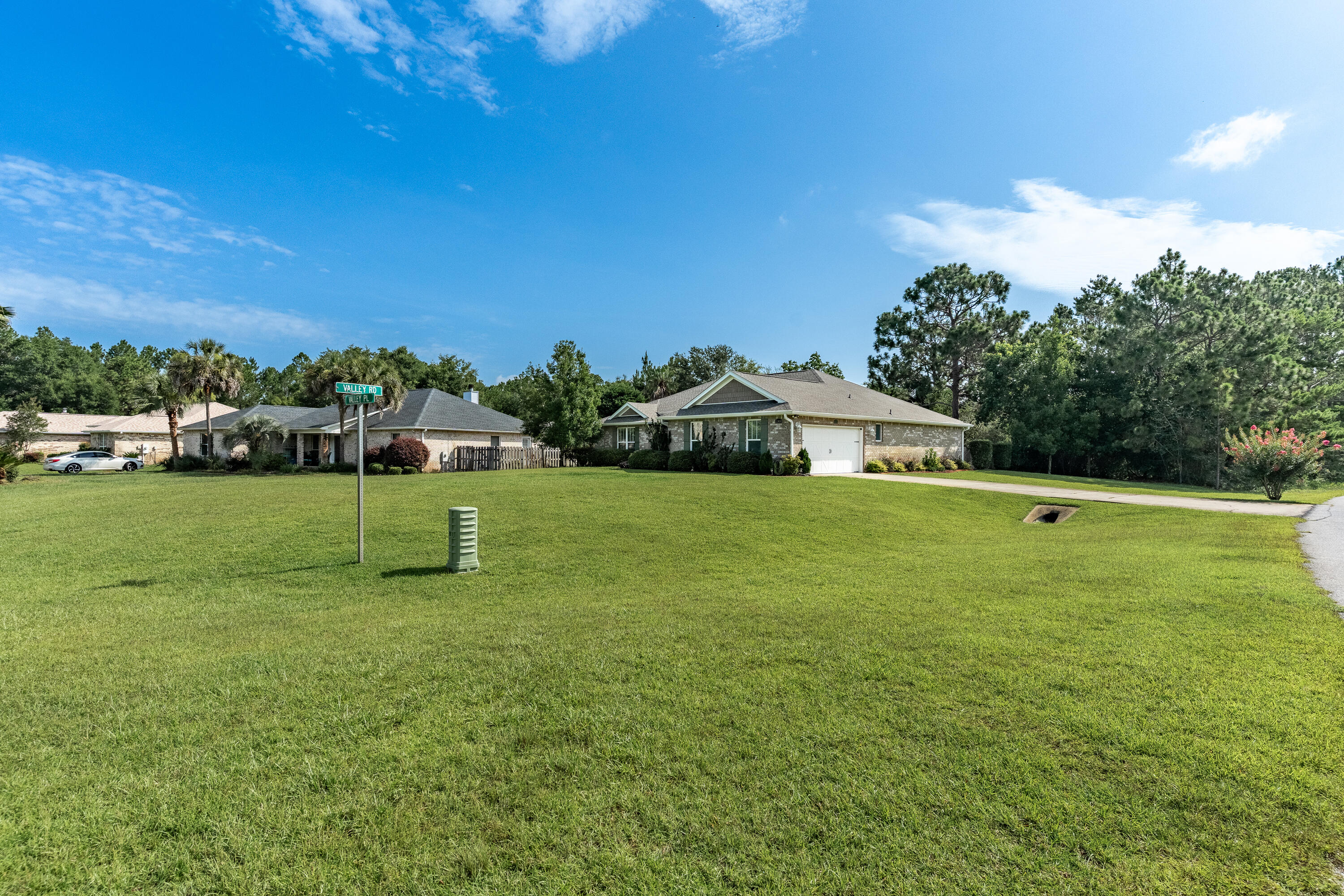 2300 Valley Place Navarre, FL 32566 - Photo 77 of 81 a view of a house with a yard porch and sitting area