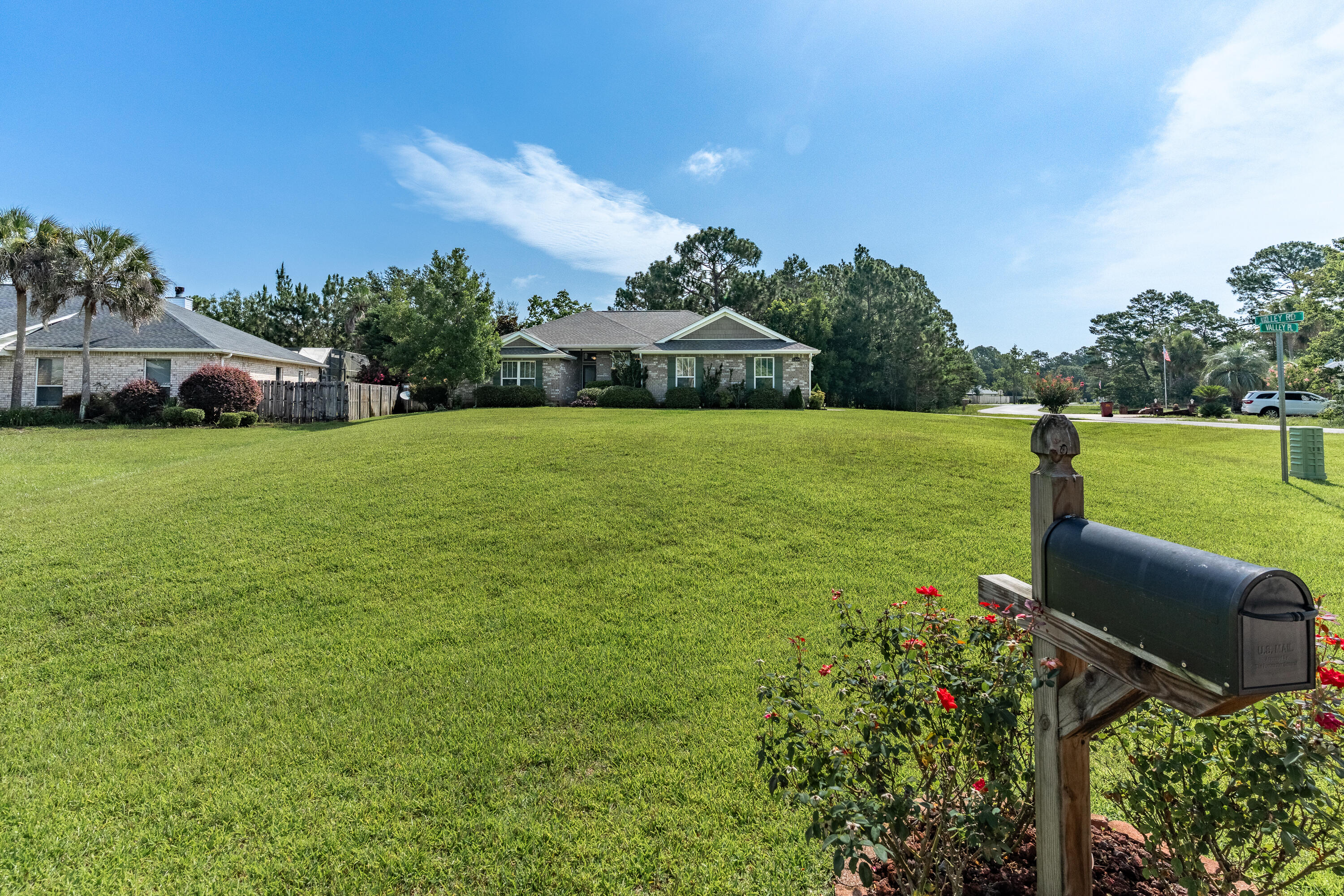 2300 Valley Place Navarre, FL 32566 - Photo 79 of 81 a front view of a house with garden