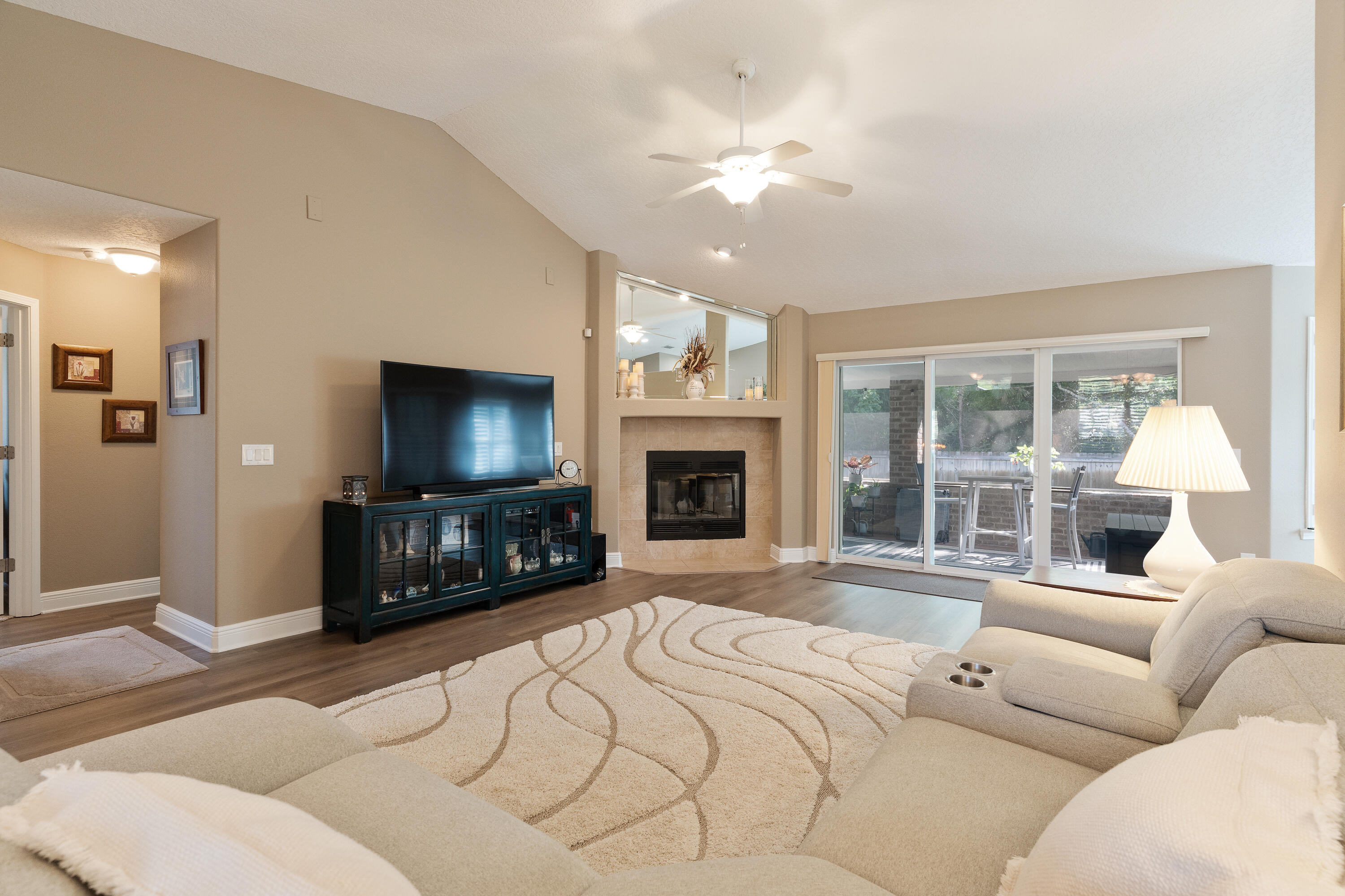 2300 Valley Place Navarre, FL 32566 - Photo 8 of 81 a bedroom with a large bed and a flat screen tv