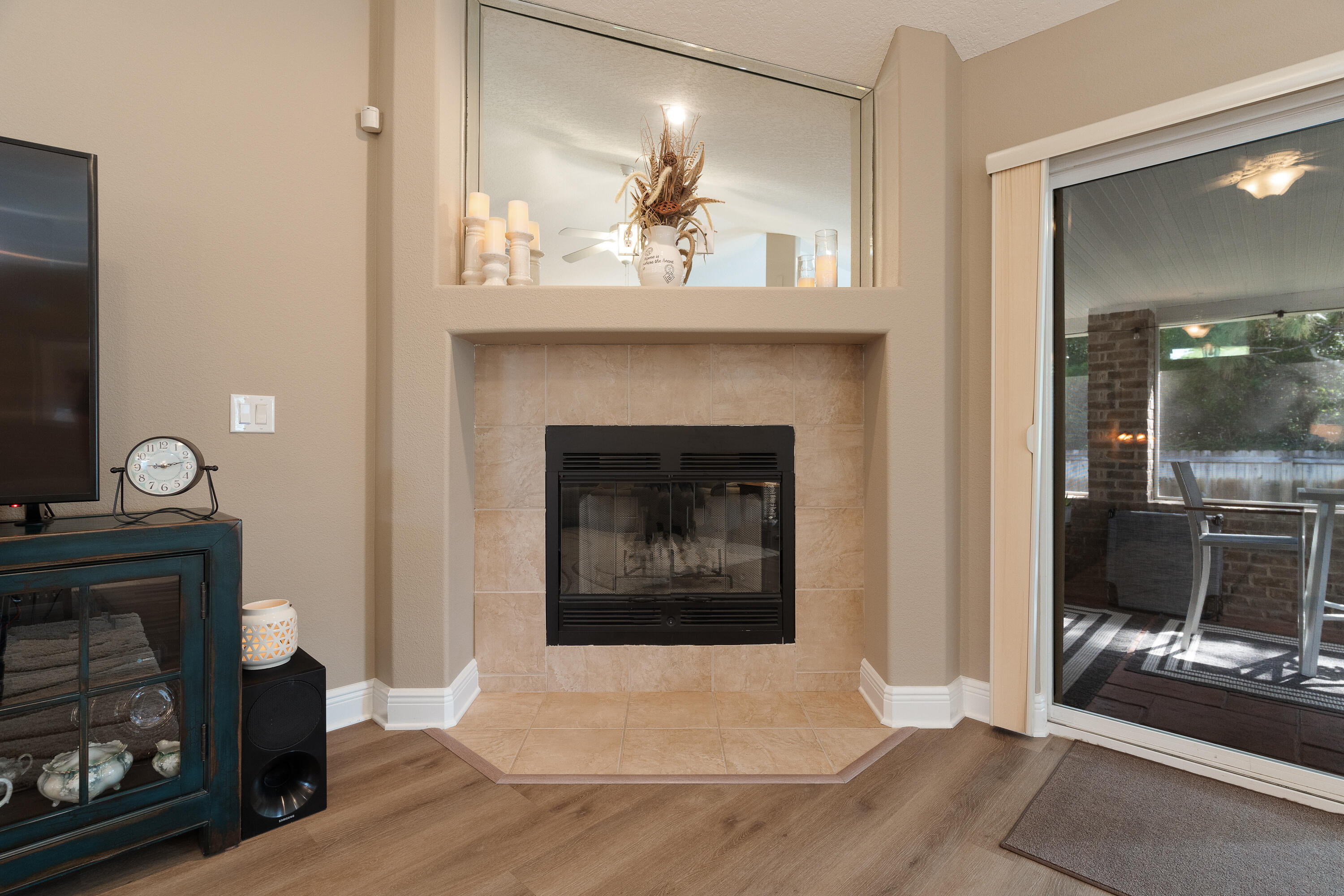 2300 Valley Place Navarre, FL 32566 - Photo 10 of 81 a living room with furniture a fireplace and a flat screen tv