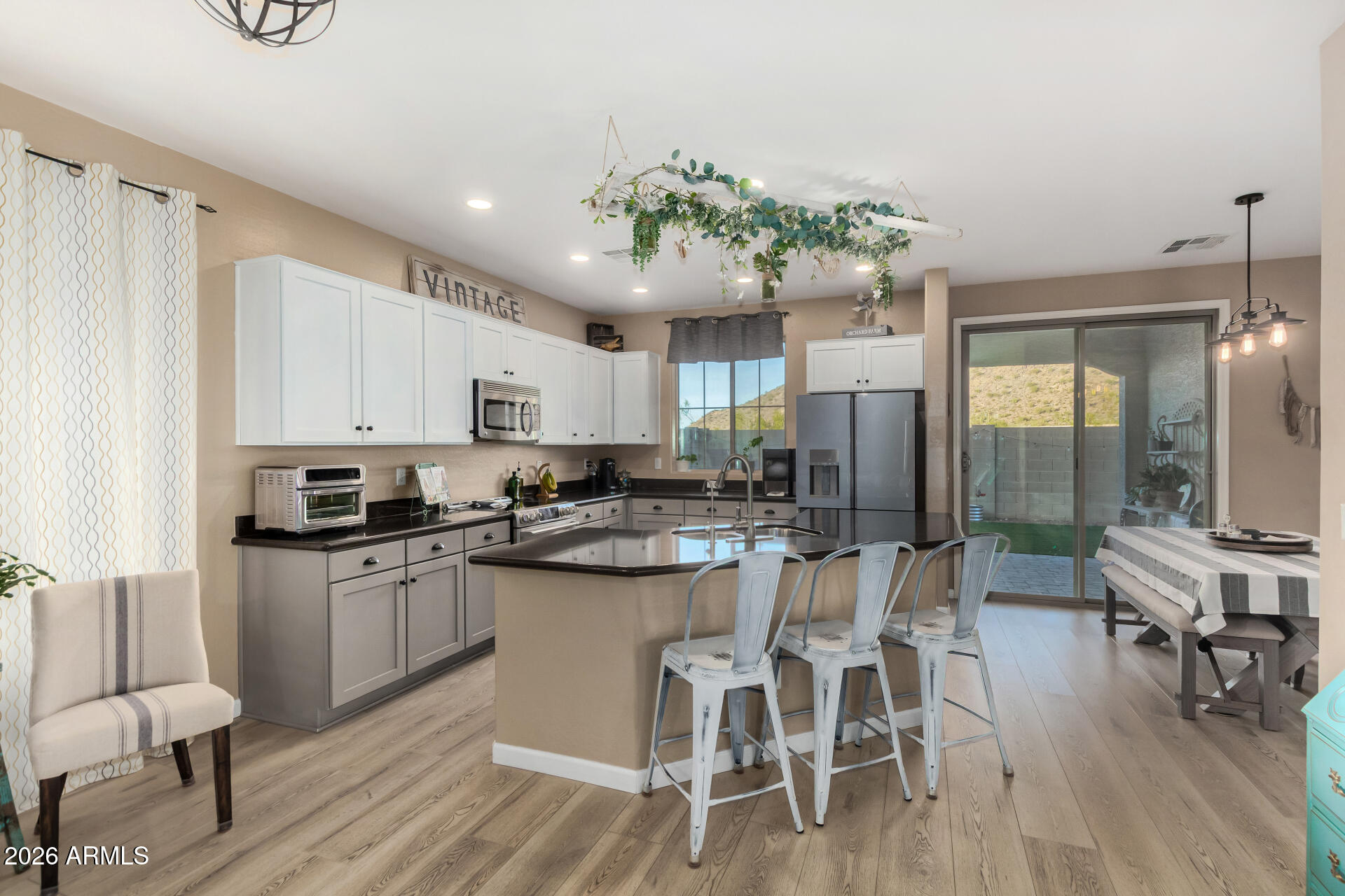 7316 West Montgomery Road Peoria, AZ 85383 - Photo 11 of 49 a kitchen with a table and chairs in it